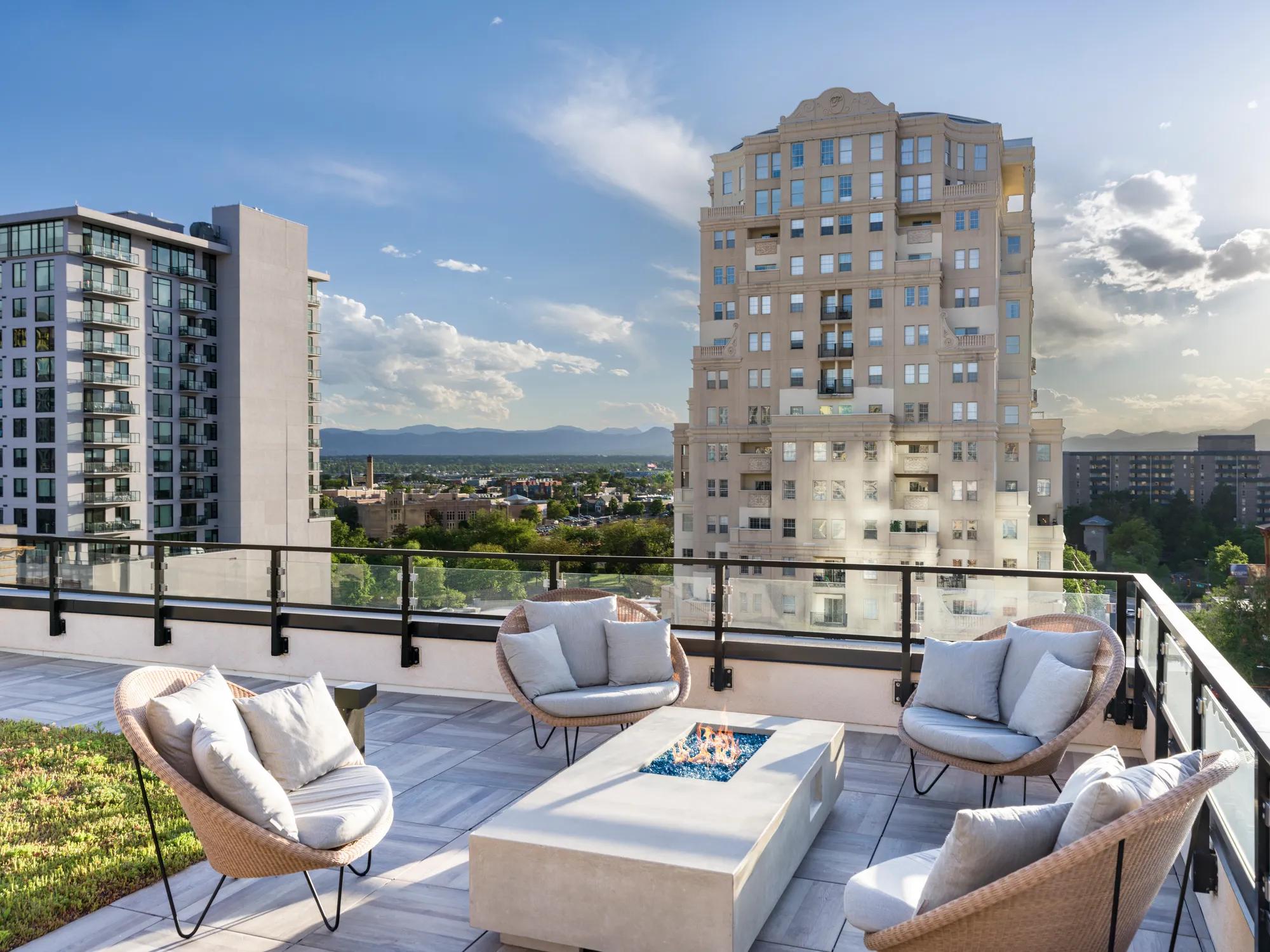rooftop lounge with small fire pit and city views modera golden triangle apartment homes for rent in denver co