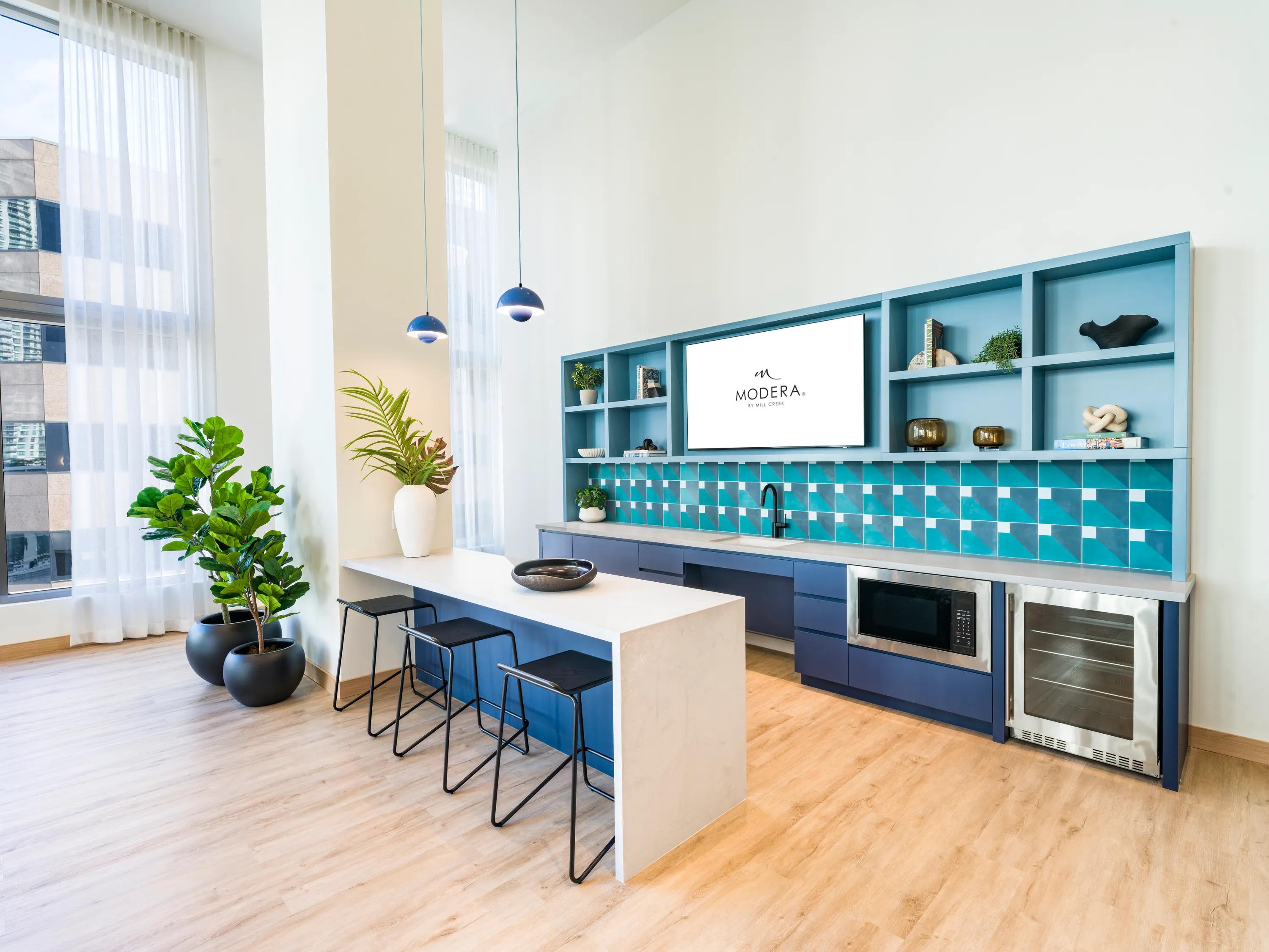 kitchen in resident lounge with bar seating modera riverside apartment homes for rent in miami fl