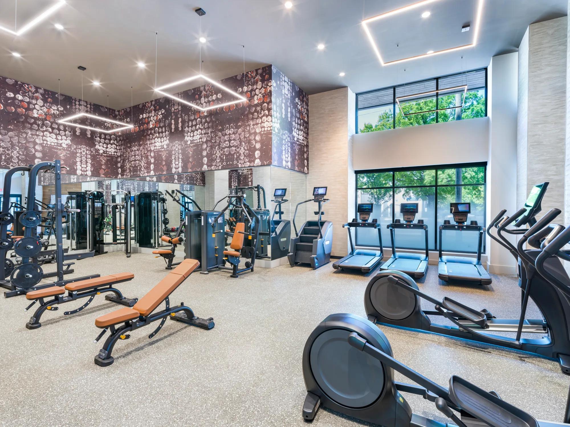 gym with weight and cardio equipment modera loso apartment homes for rent in charlotte nc