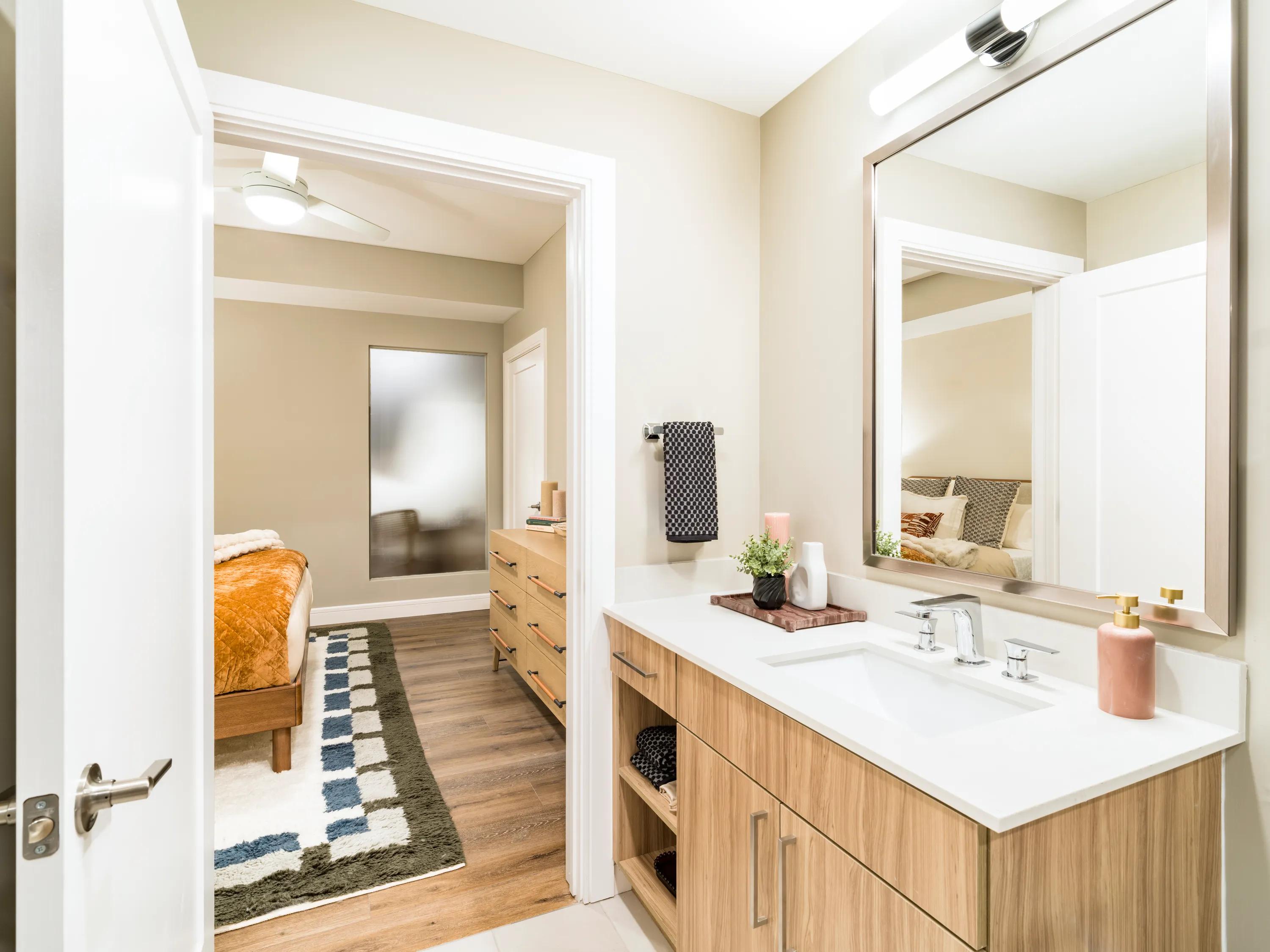 wood toned vanity in bathroom with modern accents modera mcgavock apartments for rent in nashville tn
