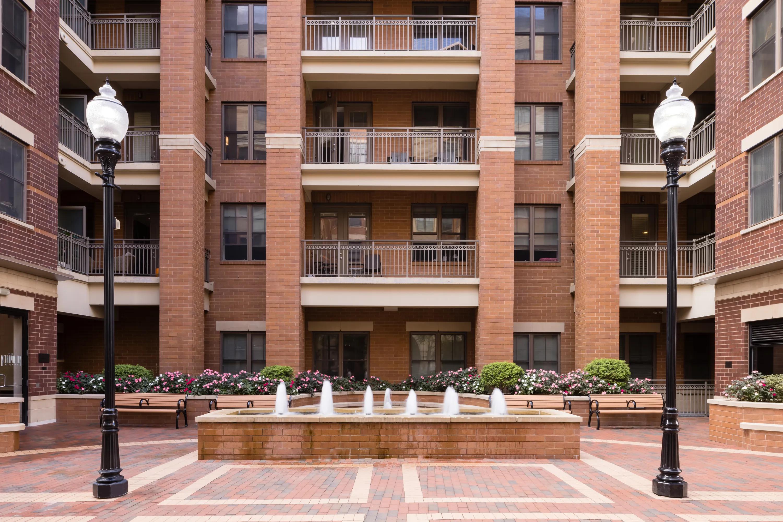 courtyard with water feature and raised garden beds metropolitan at 40 park apartment homes for rent in morristown nj
