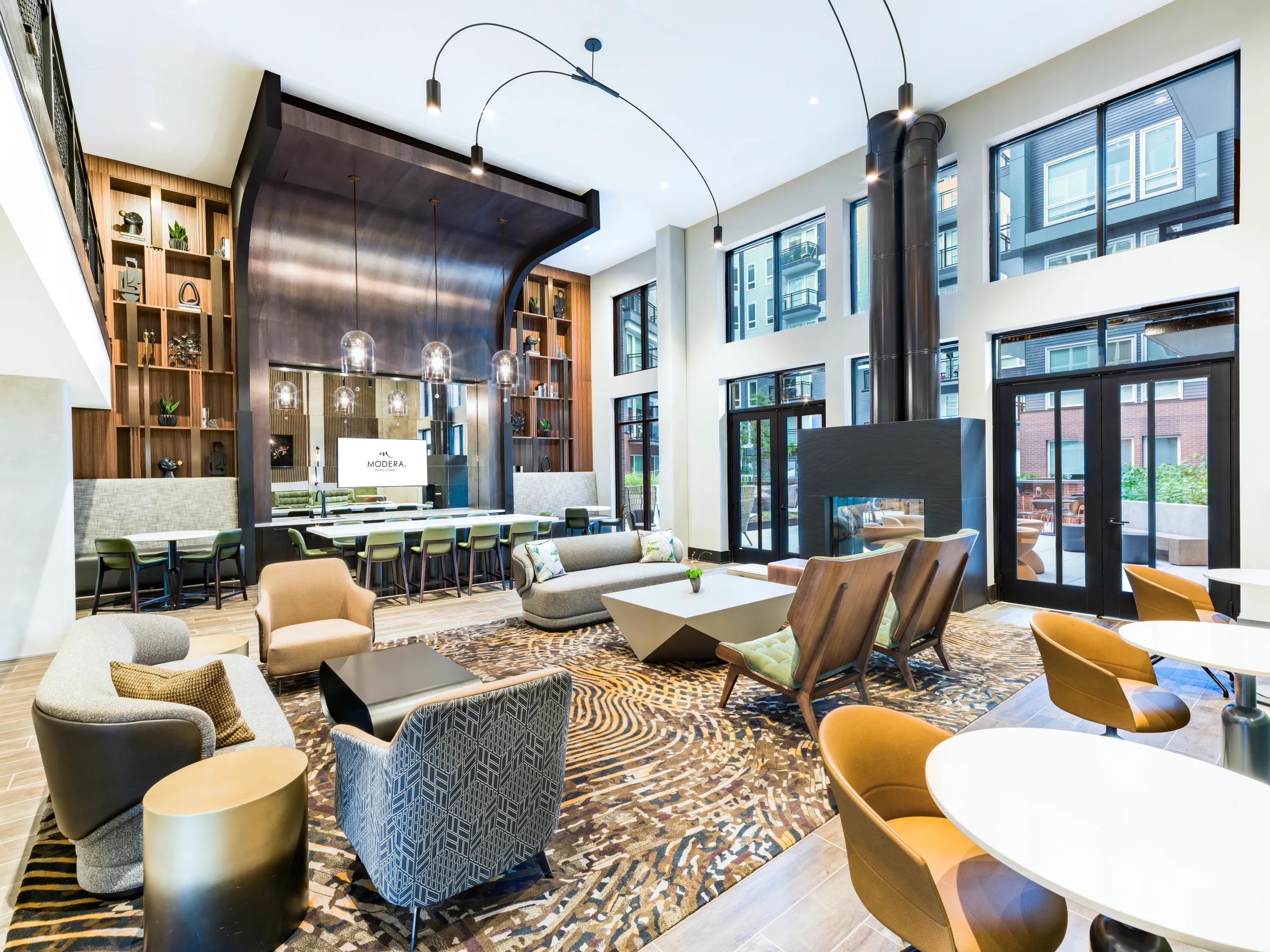 lounge with large windows and plenty of seating modera h street apartment homes for rent in washington dc