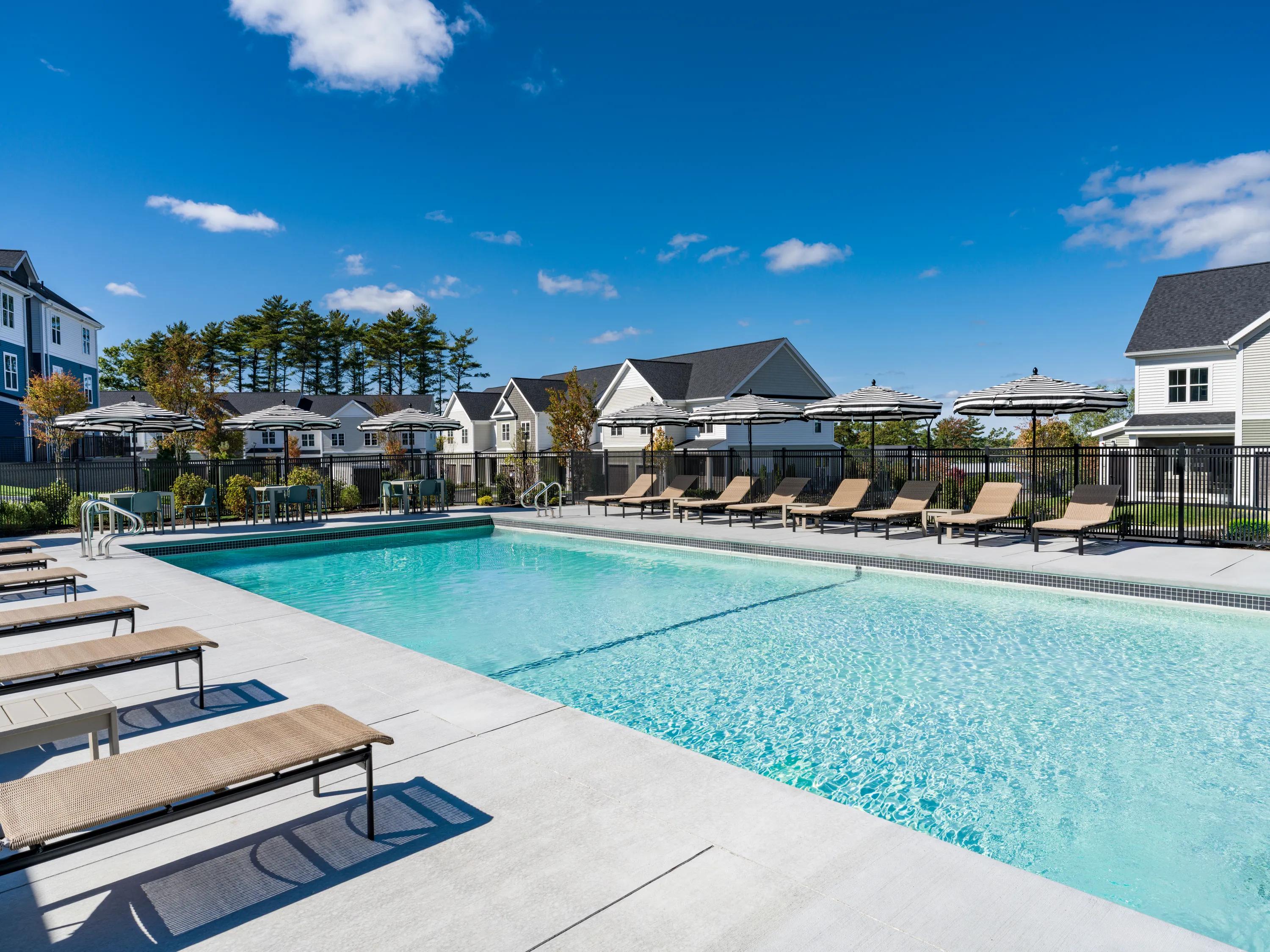 pool and sundeck with covered seating modera south shore apartment homes for rent in marshfield ma