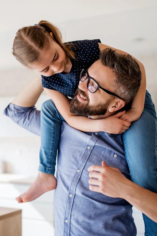 father and young daughter embracing modera reynoldstown apartments in atlanta ga