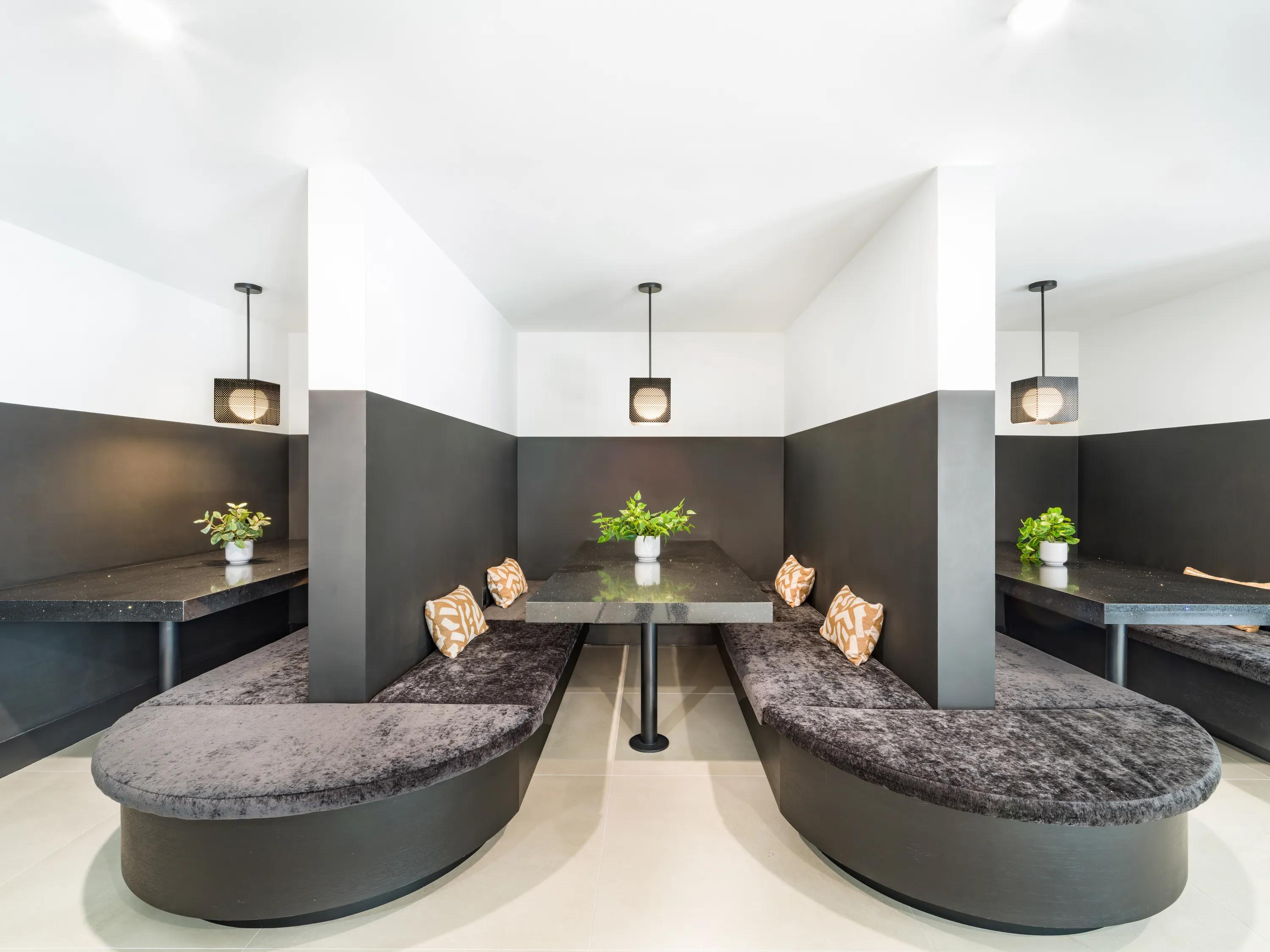 Semi-private dining booths with curved banquette seating modera coral springs phase 2 apartments in coral springs fl