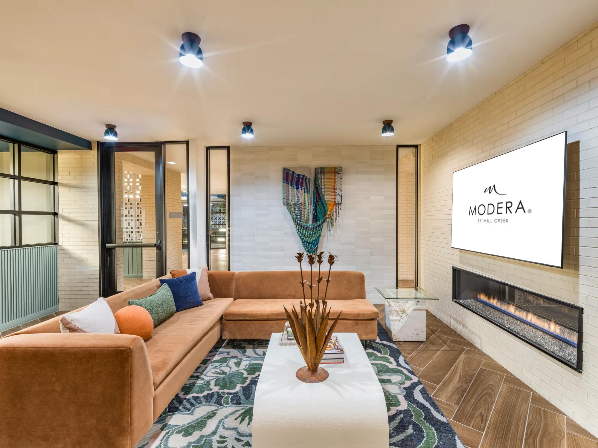 Modera EaDo's TV lounge, with comfortable seating