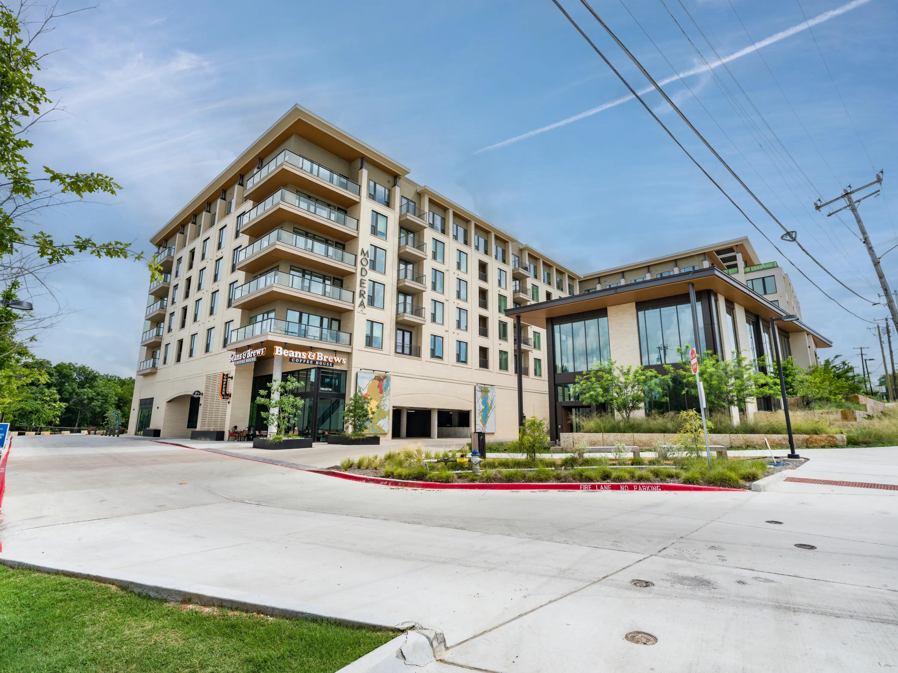 exterior office and retail entrance modera trailhead apartments for rent dallas tx