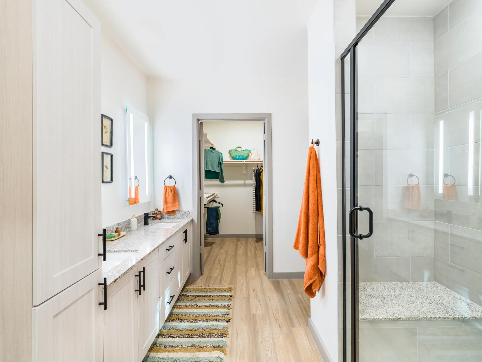 serent bathrooms with custom cabinetry and quartz countertops