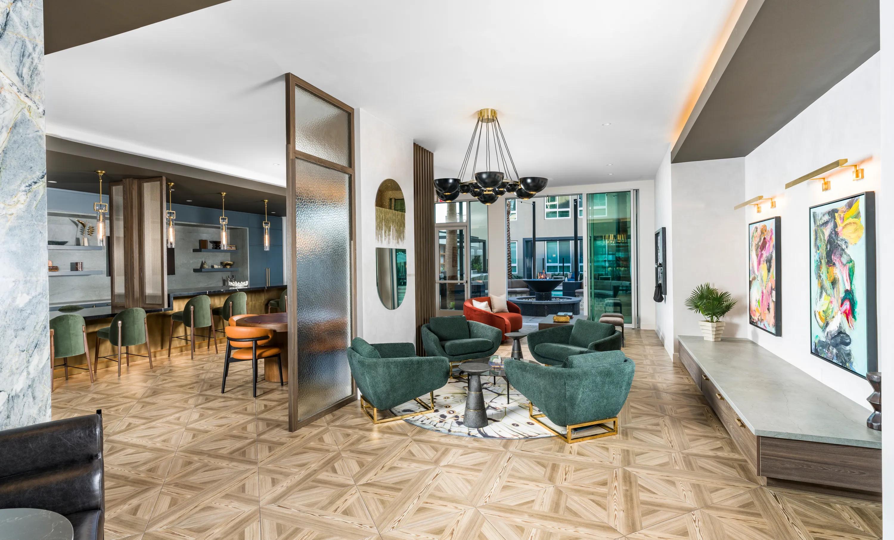 clubroom areas with couches and art modera pomona apartments pomona ca