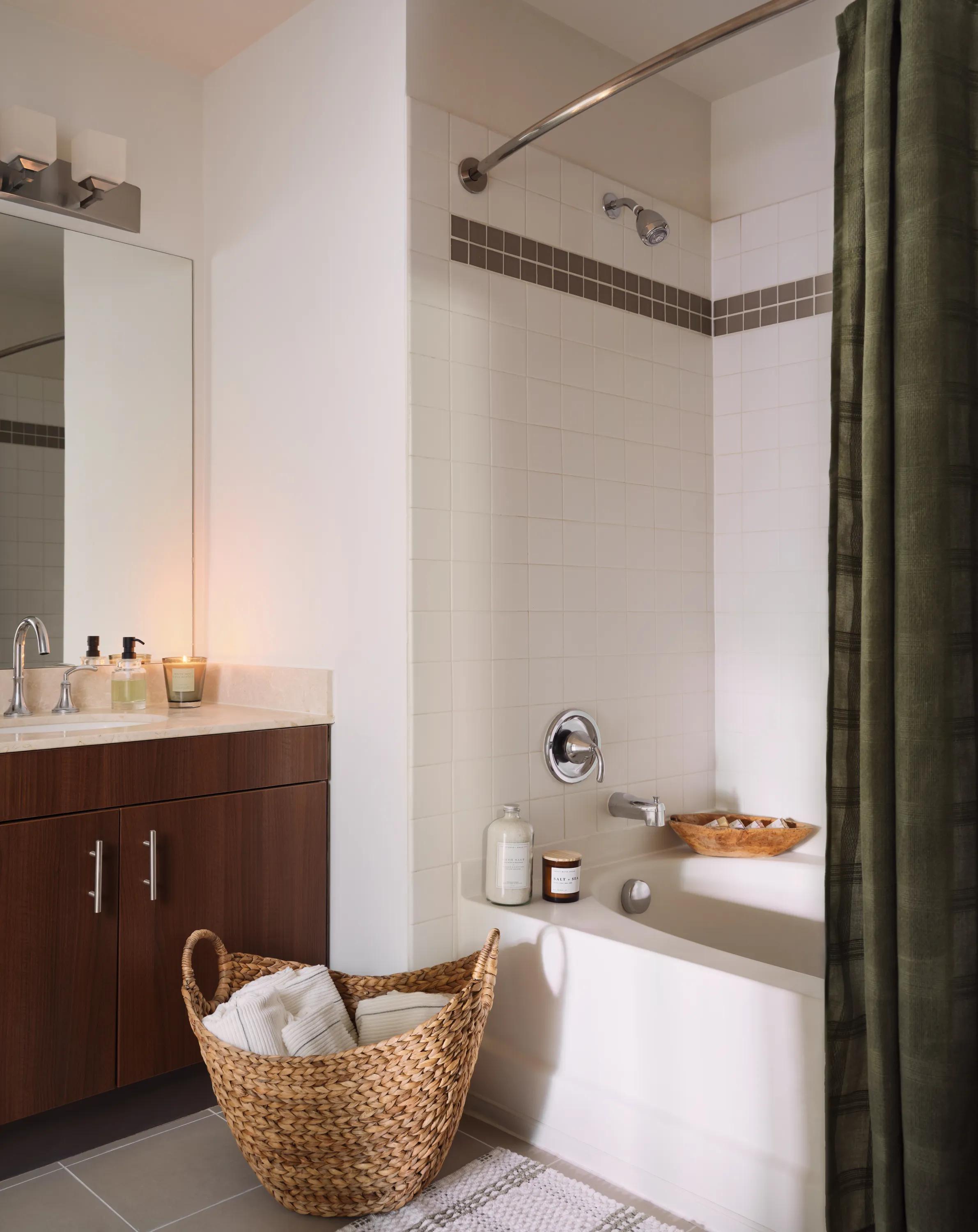 bathroom with bathtub and dark cabinetry metropolitan at 40 park apartment homes for rent in morristown nj
