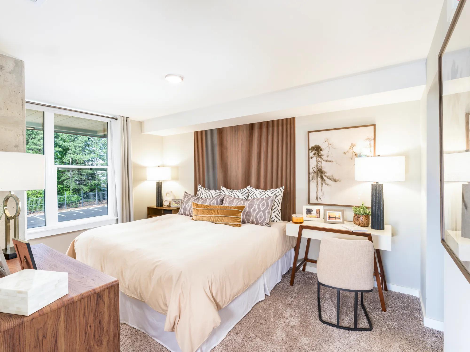 spacious bedroom with desk and large window modera loso apartment homes for rent in charlotte nc