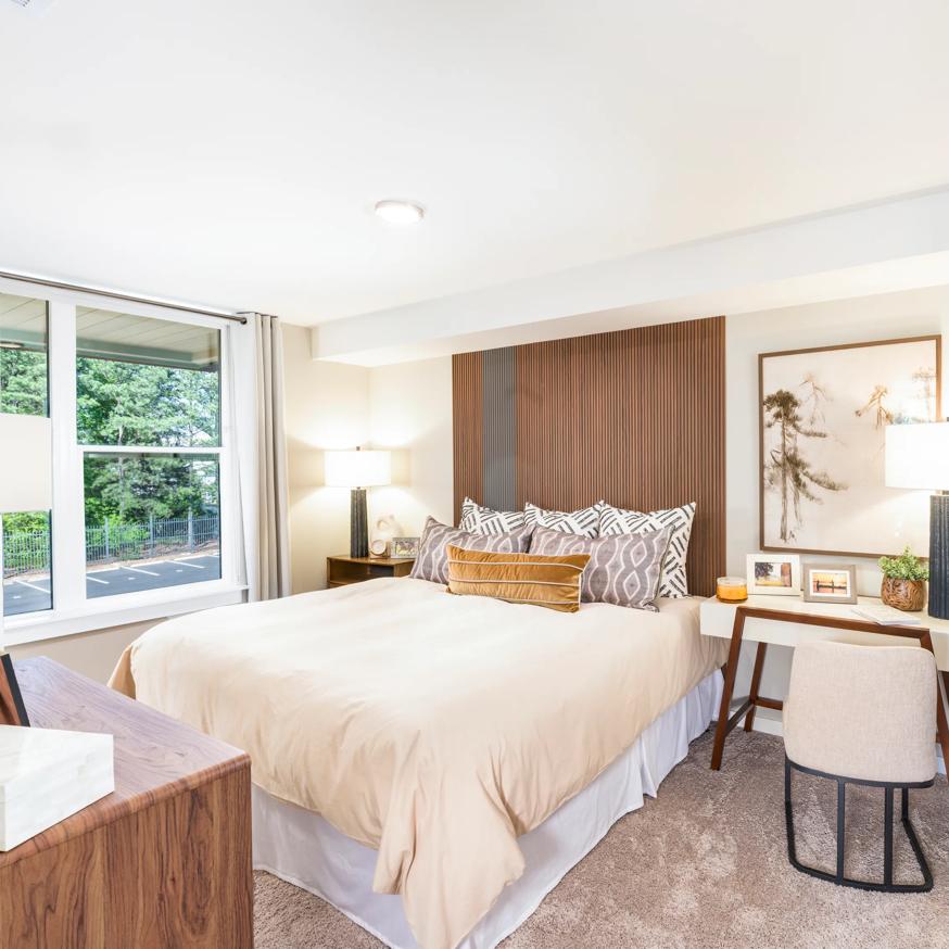 spacious bedroom with large windows and desk modera loso apartment homes for rent in charlotte nc