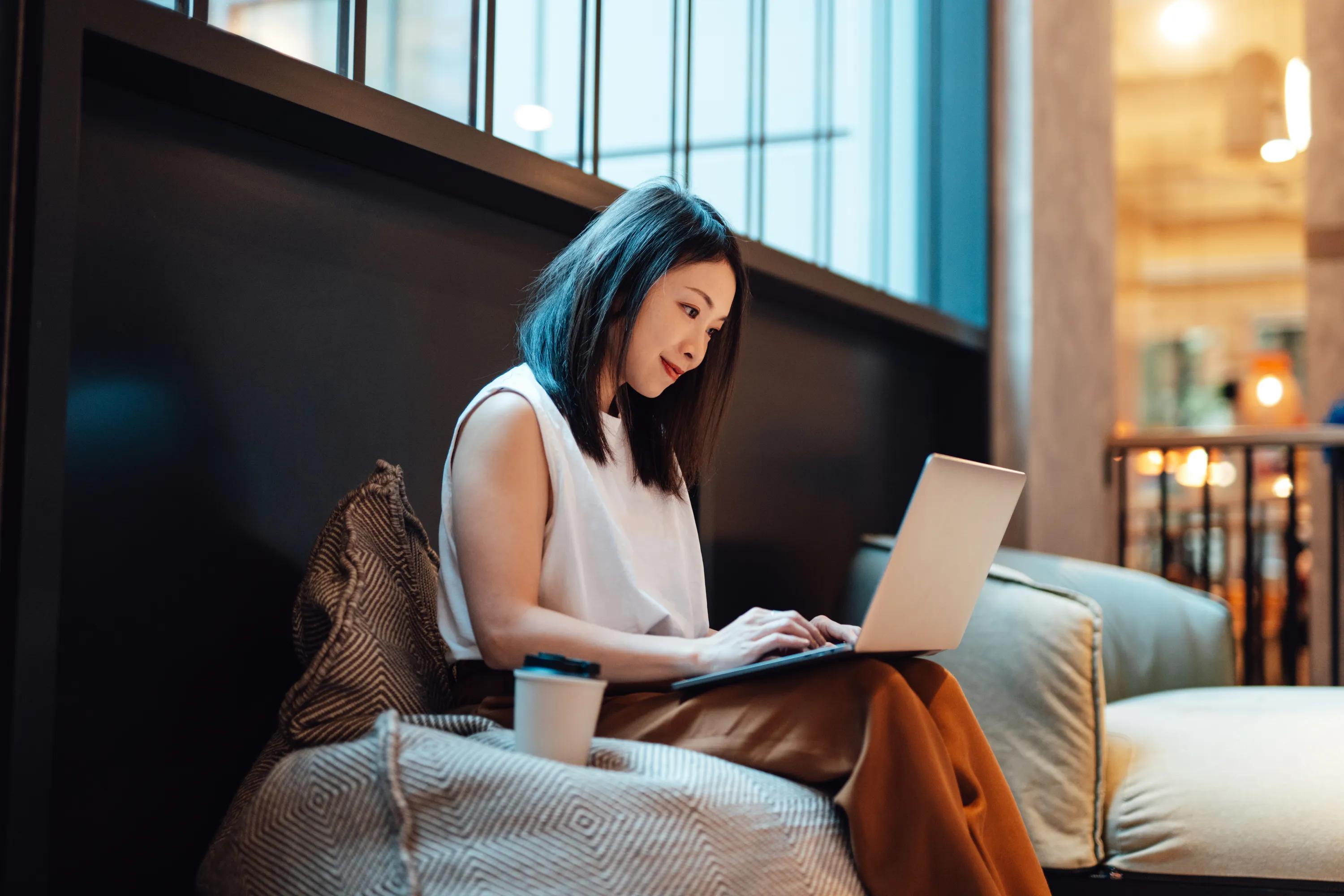 Coworking space with private workstations and comfortable seating areas