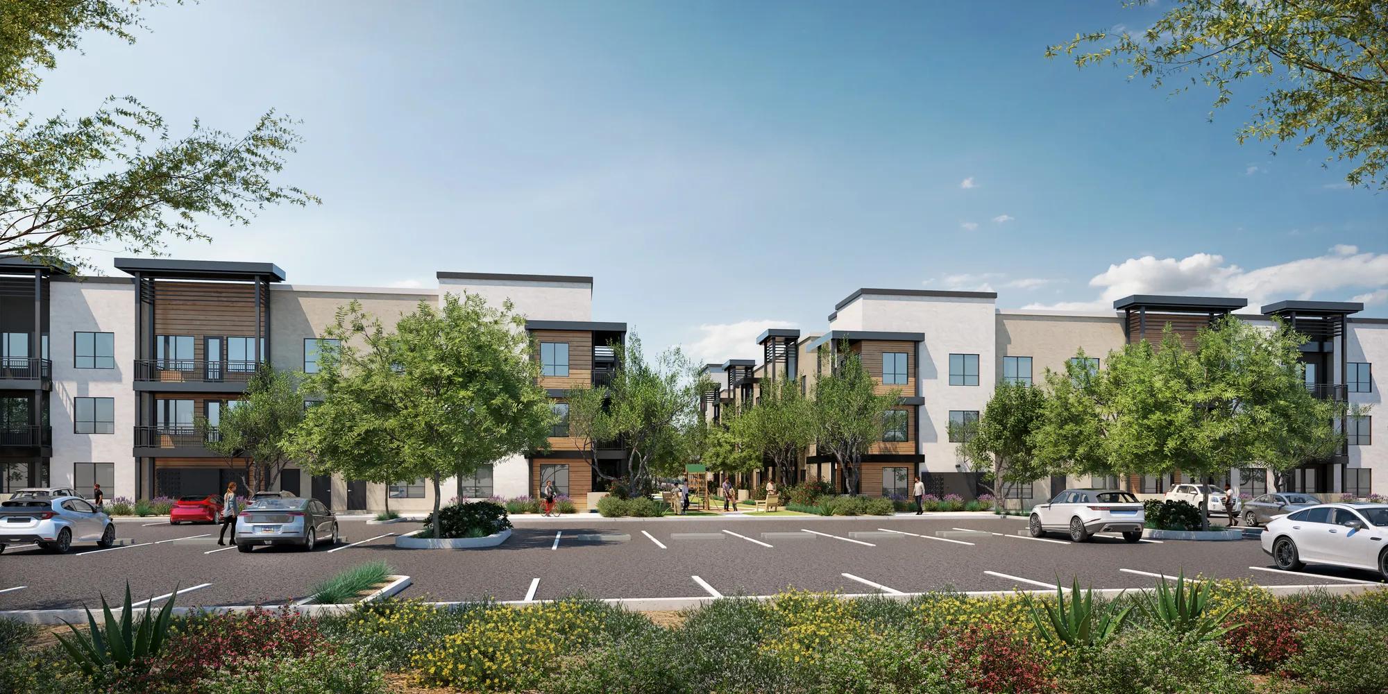 retail and parking on exterior of apartment building with blue sky above modera higley commons apartment homes for rent in gilbert az