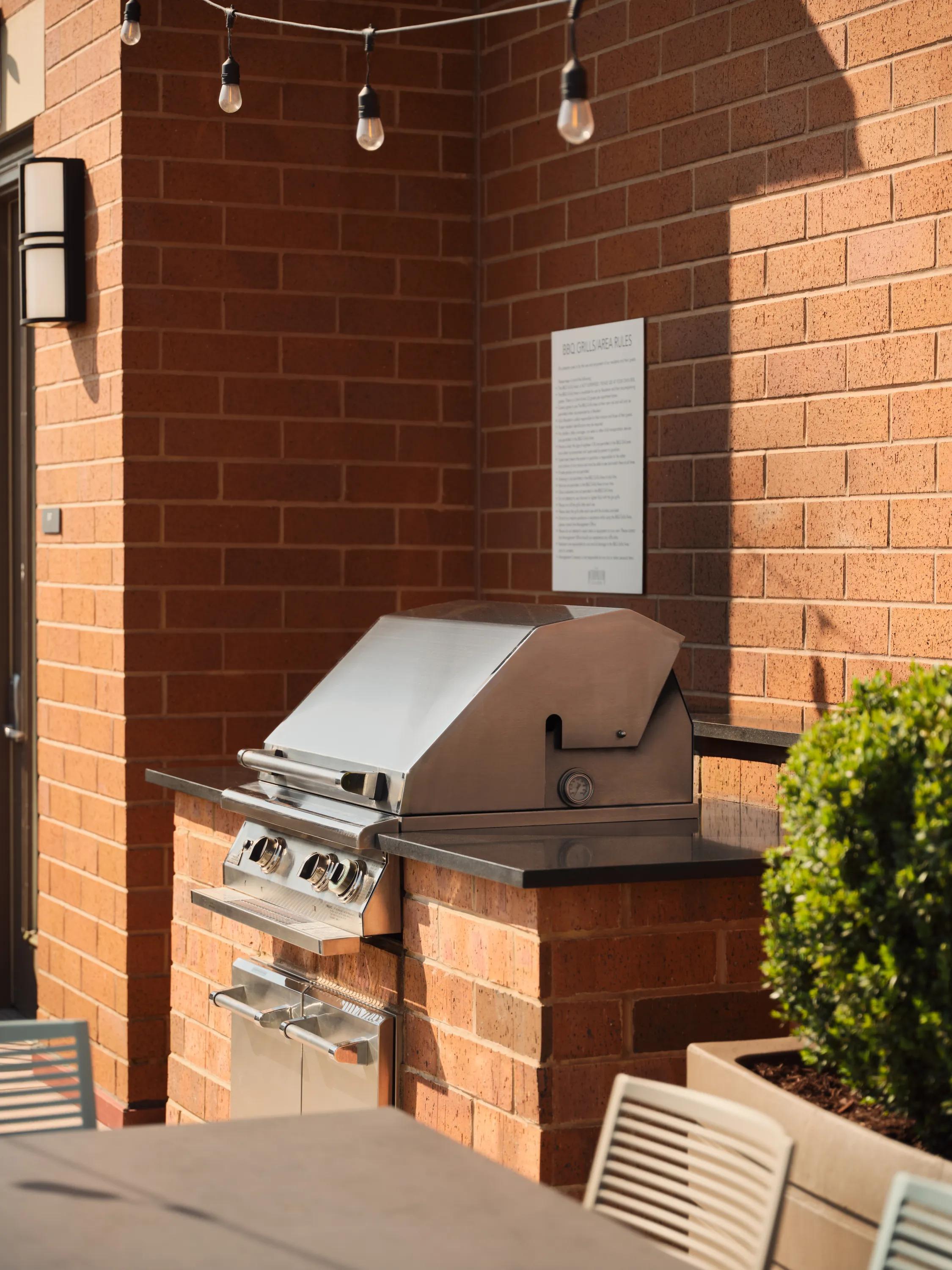 bbq grill with string lighting overhead metropolitan at 40 park apartment homes for rent in morristown nj
