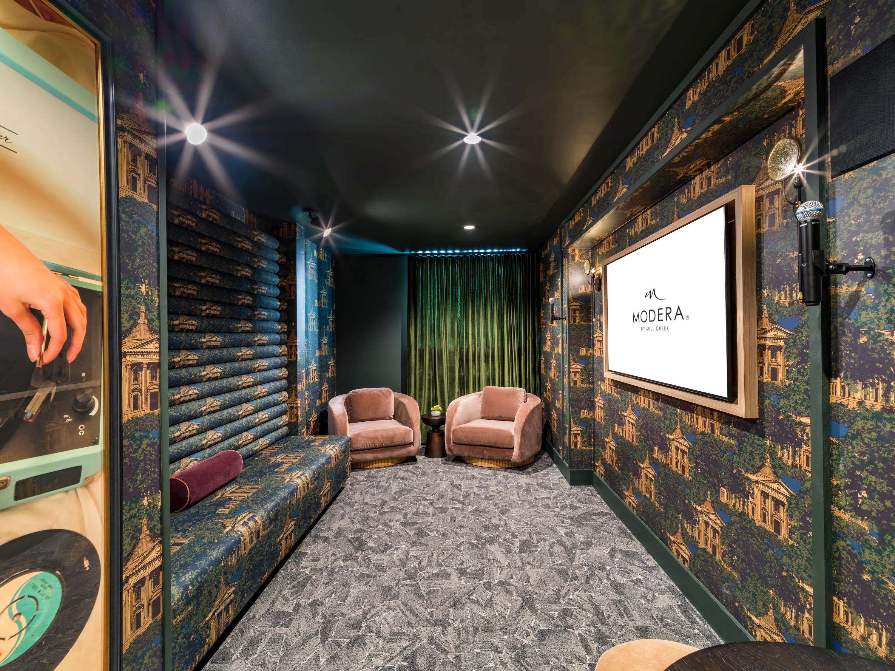 karaoke room with seating and tables and tv rendering modera st. paul apartment homes for rent in dallas tx