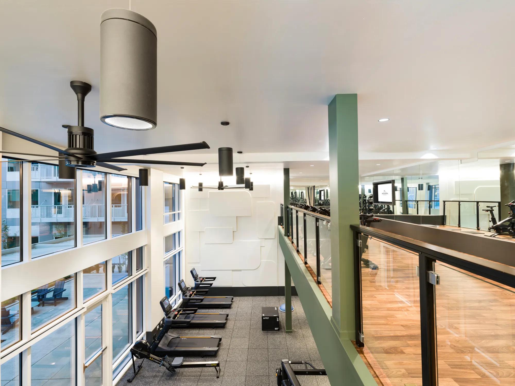 upper floor of multi level fitness center at modera raleigh hills