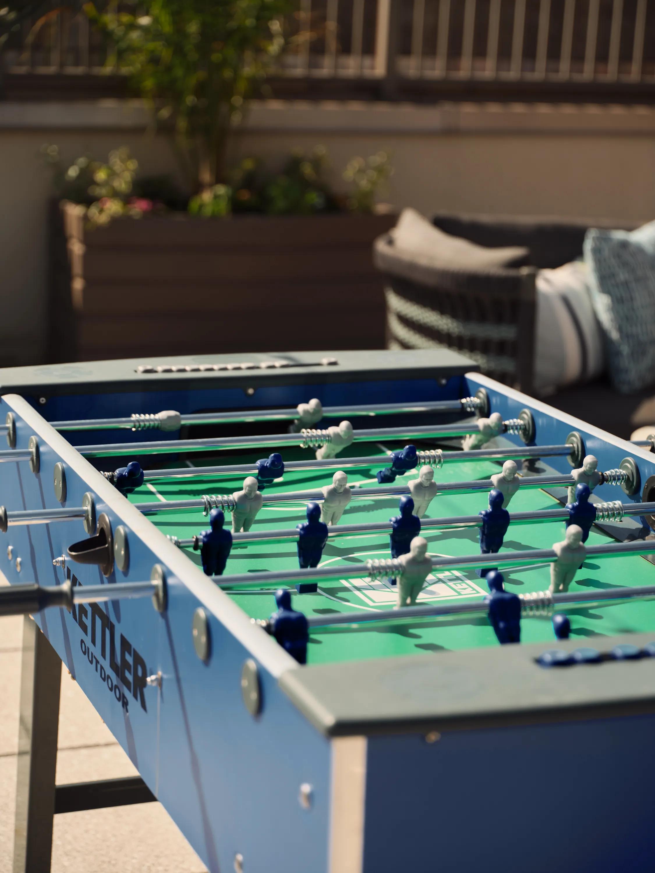 foosball table outside on rooftop metropolitan at 40 park apartment homes for rent in morristown nj