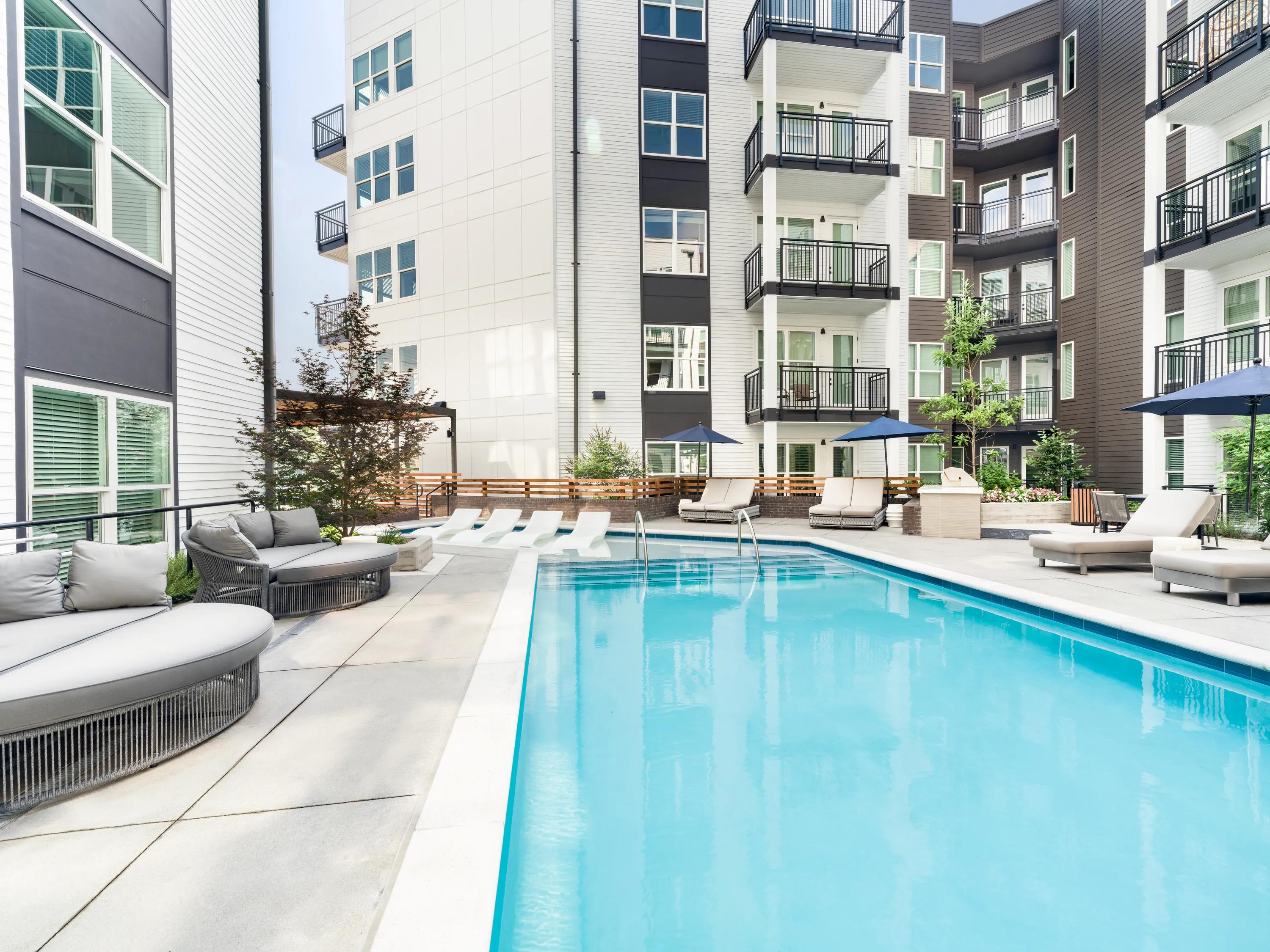 Pool courtyard with in-water loungers modera westside trail apartment homes for rent in atlanta ga