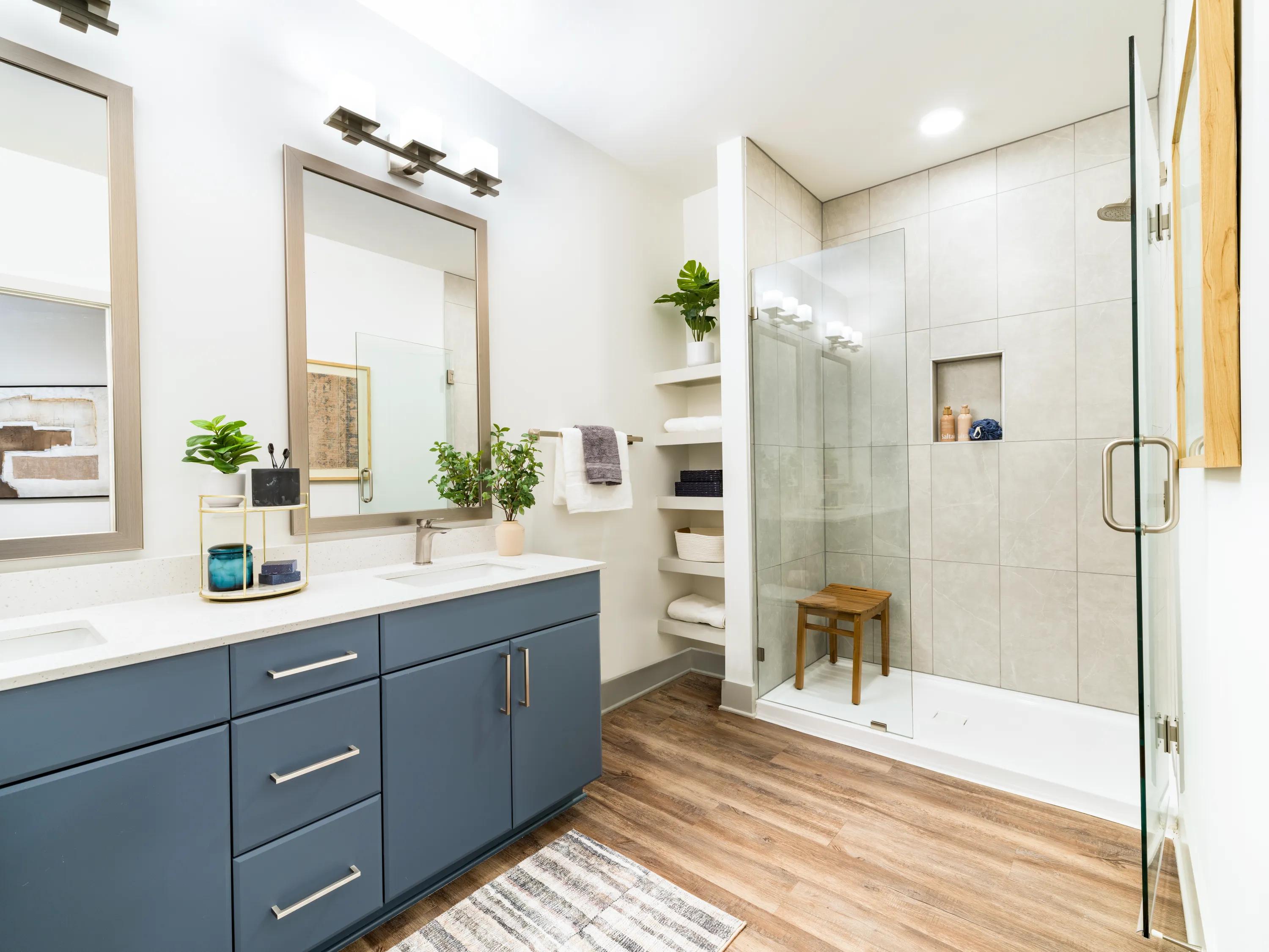 double vanity bathroom with blue cabinetry modera westside trail apartment homes for rent in atlanta ga