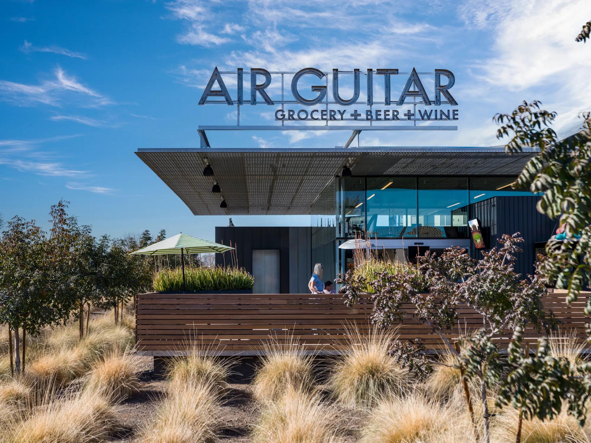 air guitar grocery store with tasteful landscaping at modera higley commons apartment homes for rent in gilbert az