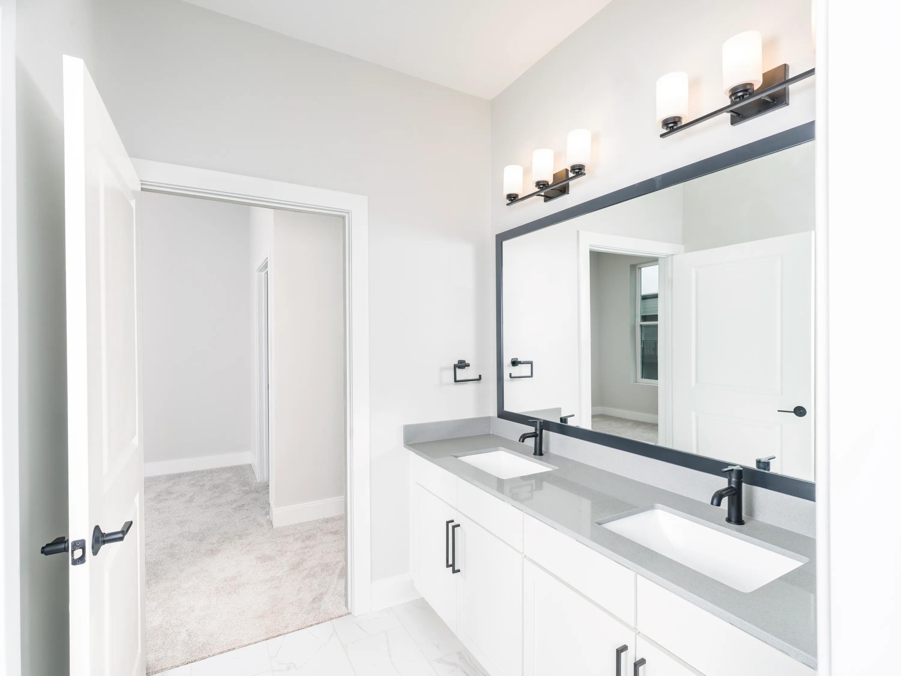 double vanity bathroom with white cabinetry modera liberty row apartment homes for rent in in charlotte nc