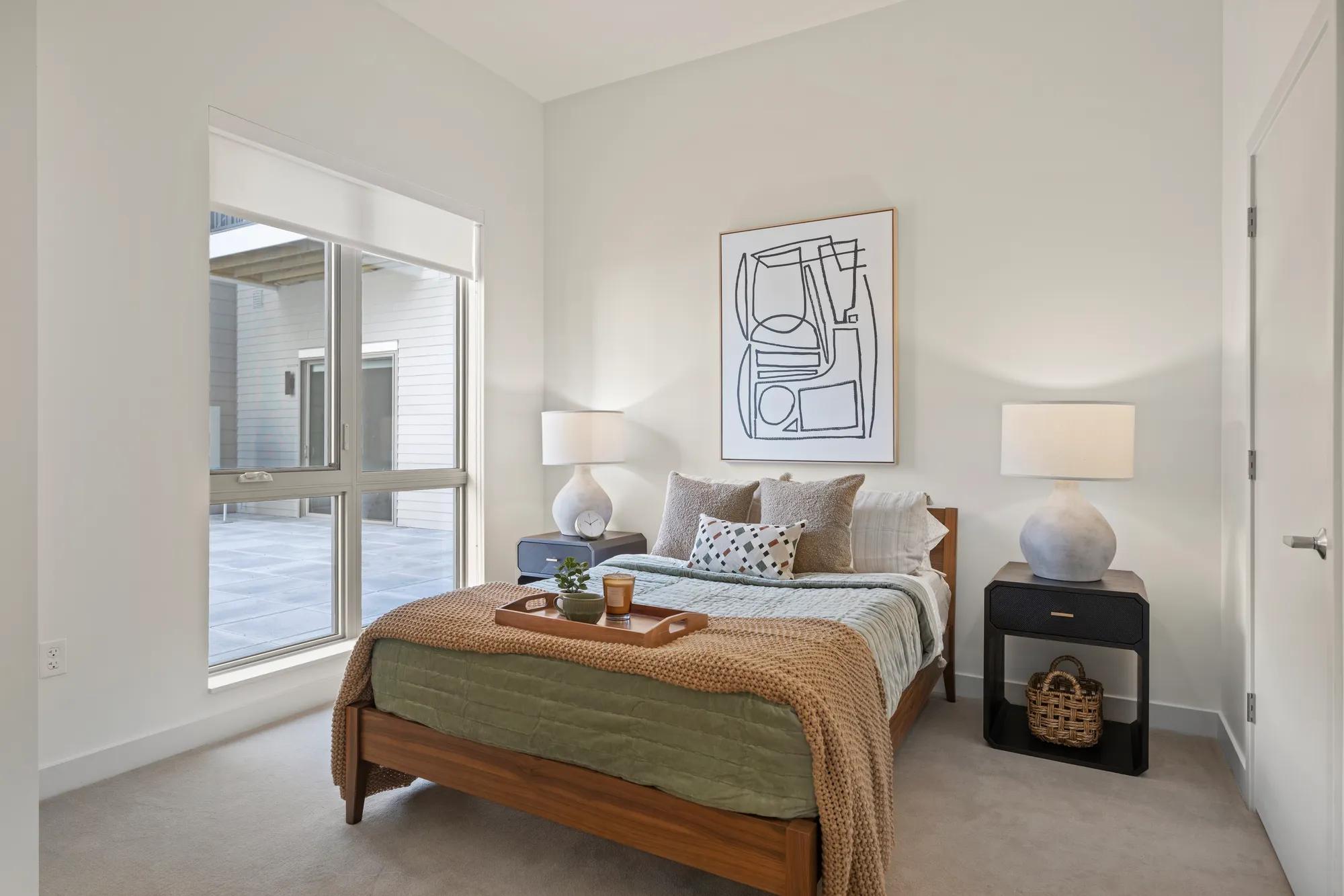 spacious befroom with furniture and ample natural light at modera newton apartment homes for rent in ma