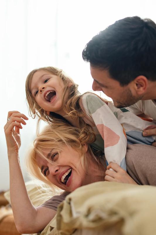 parents and child cuddling and smiling modera golden tringle apartments in denver co