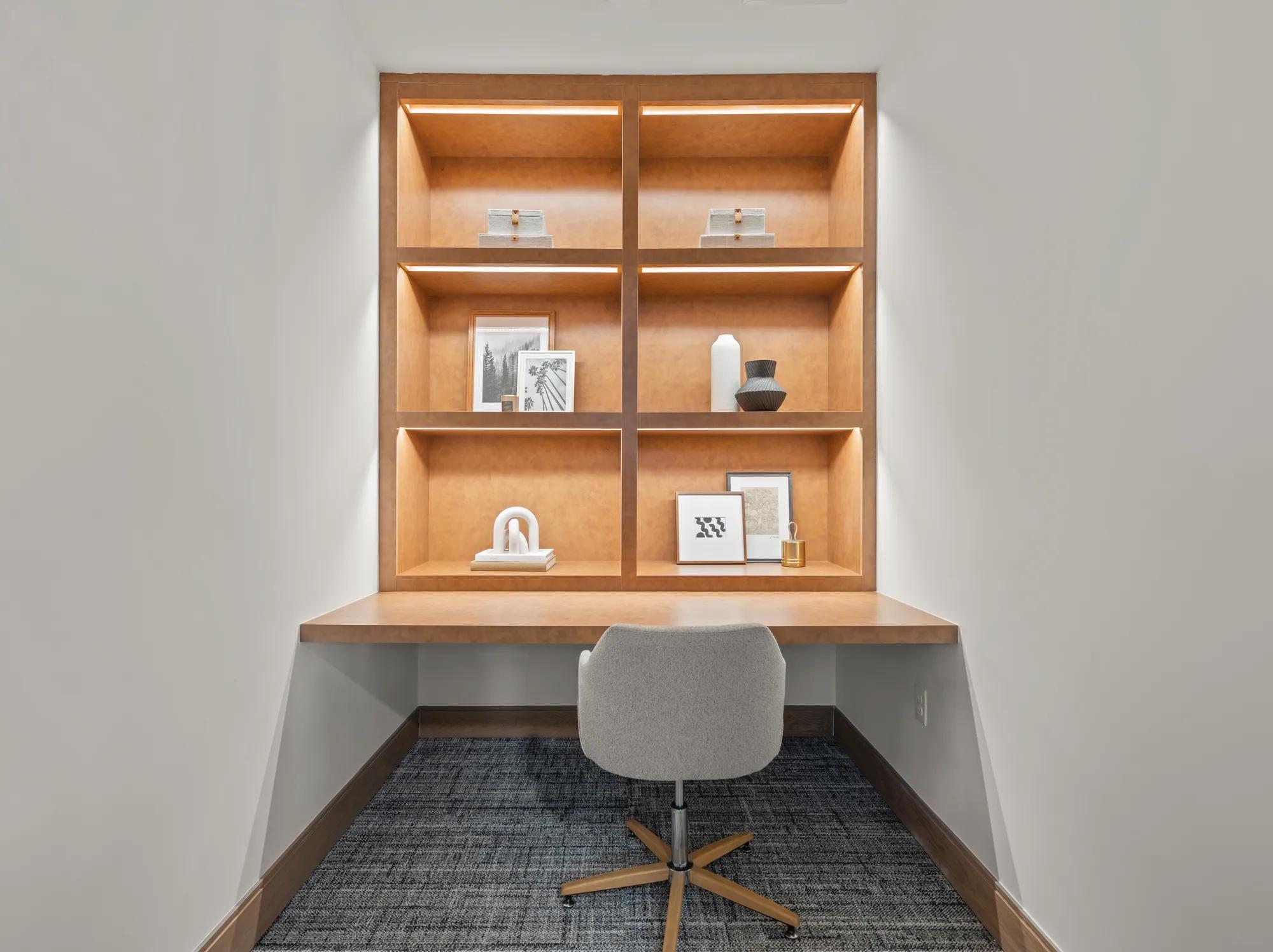 built in light wood cabinetry with decorations at modera newton apartment homes for rent in ma