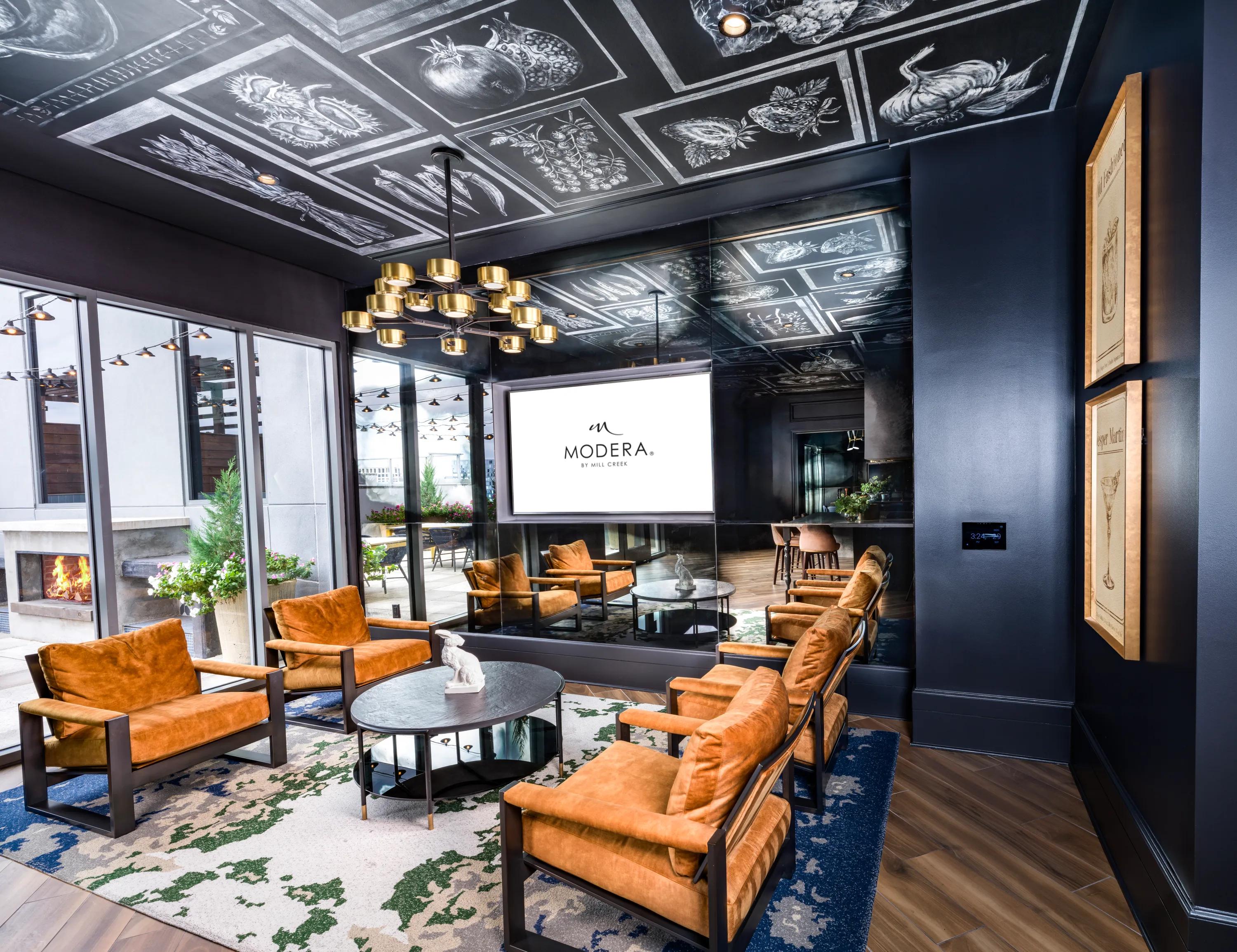 moody lounge with comfortable seating modera old ivy apartments in atlanta ga