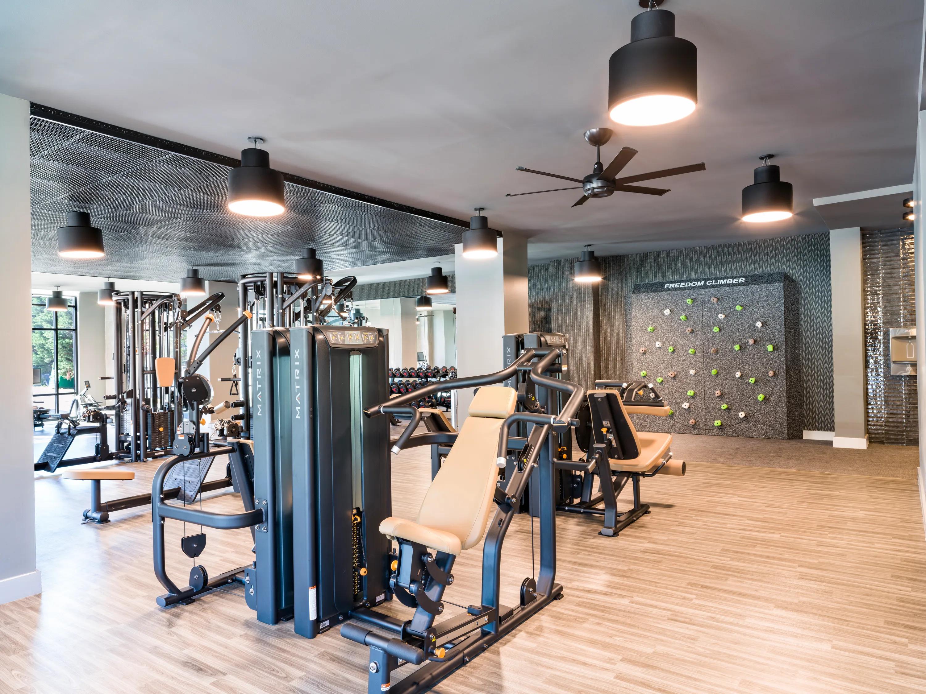 Club-quality fitness studio with TRX system, Peloton bikes, and fitness on-demand