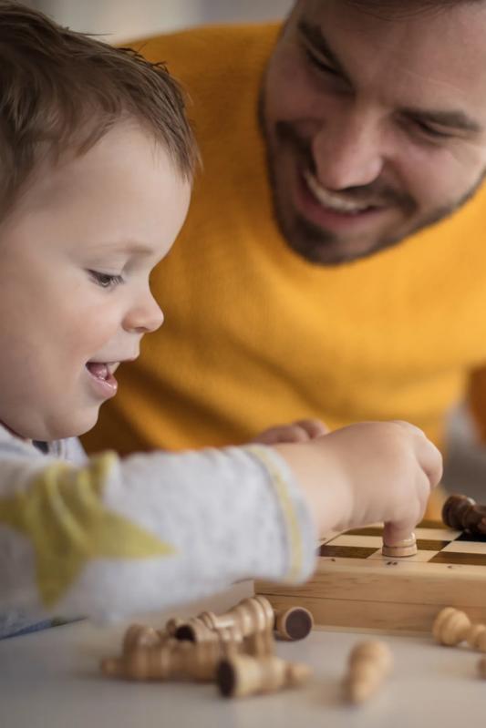 father and son playing chess