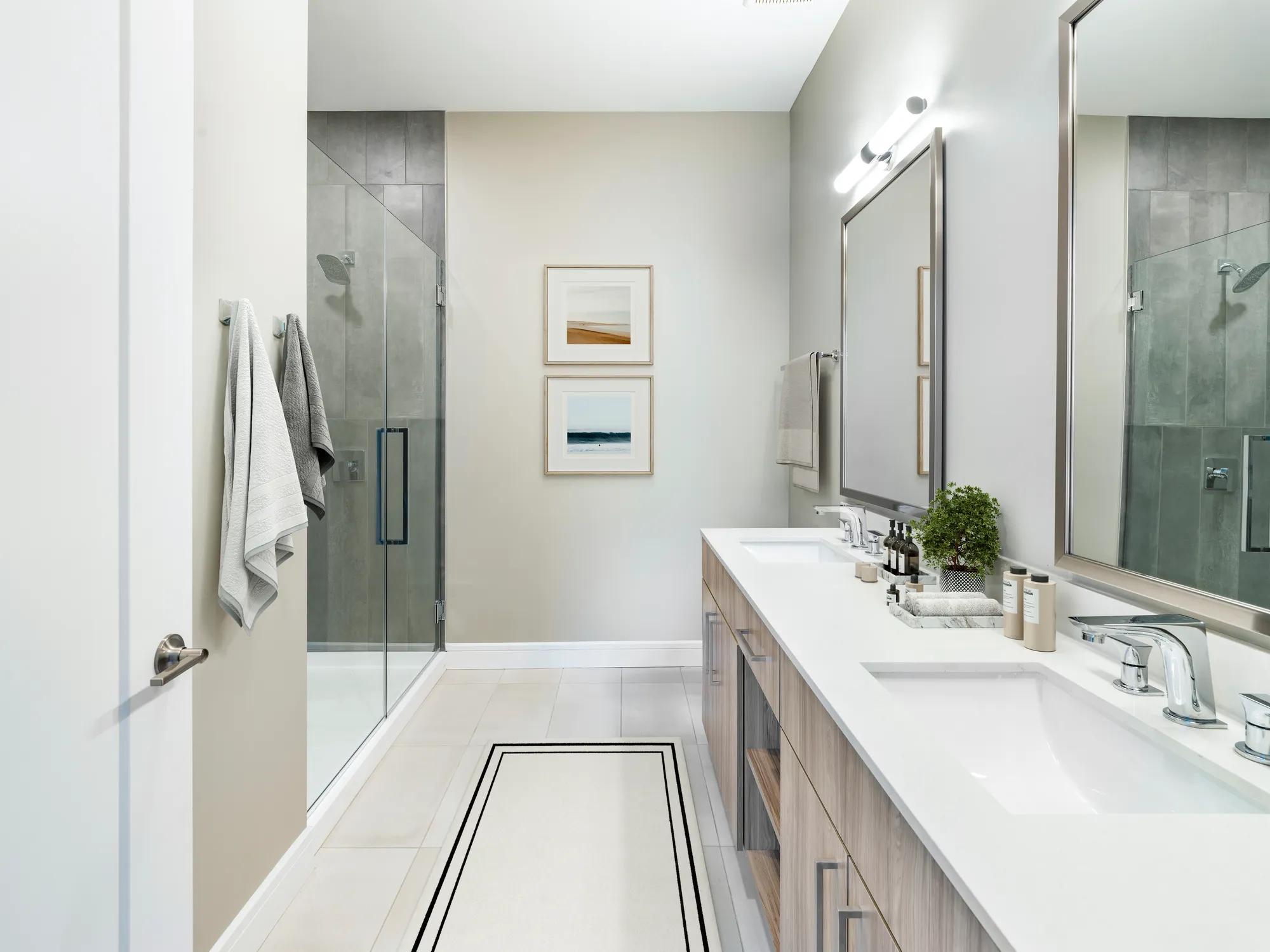 Designer bathrooms with quartz countertops and double vanities