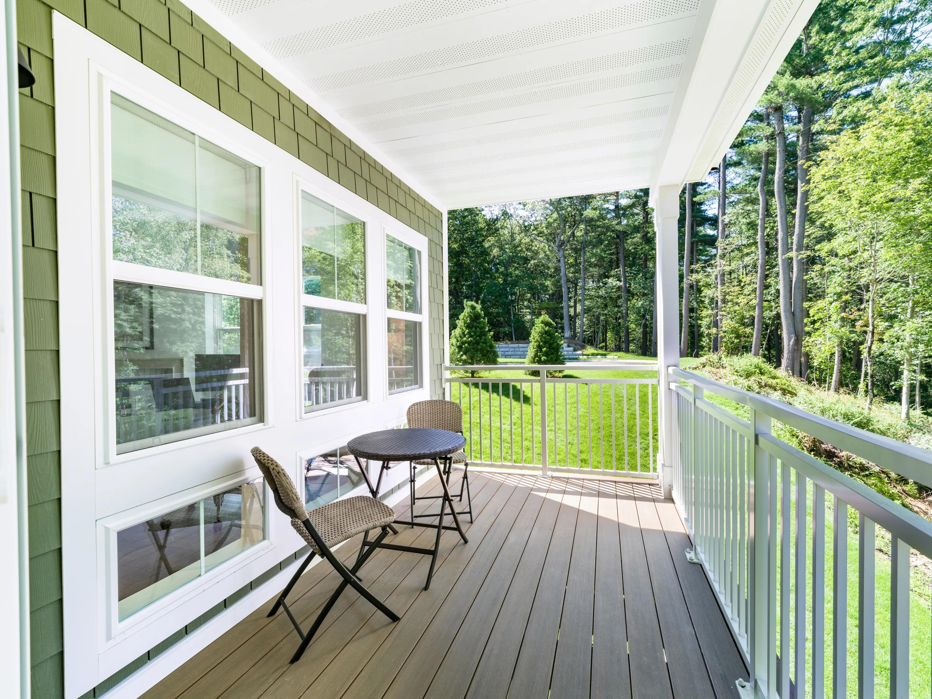 Covered porch with wooded views and room for outdoor seating modera weston apartments and townhomes for rent  for rent in weston ma near boston