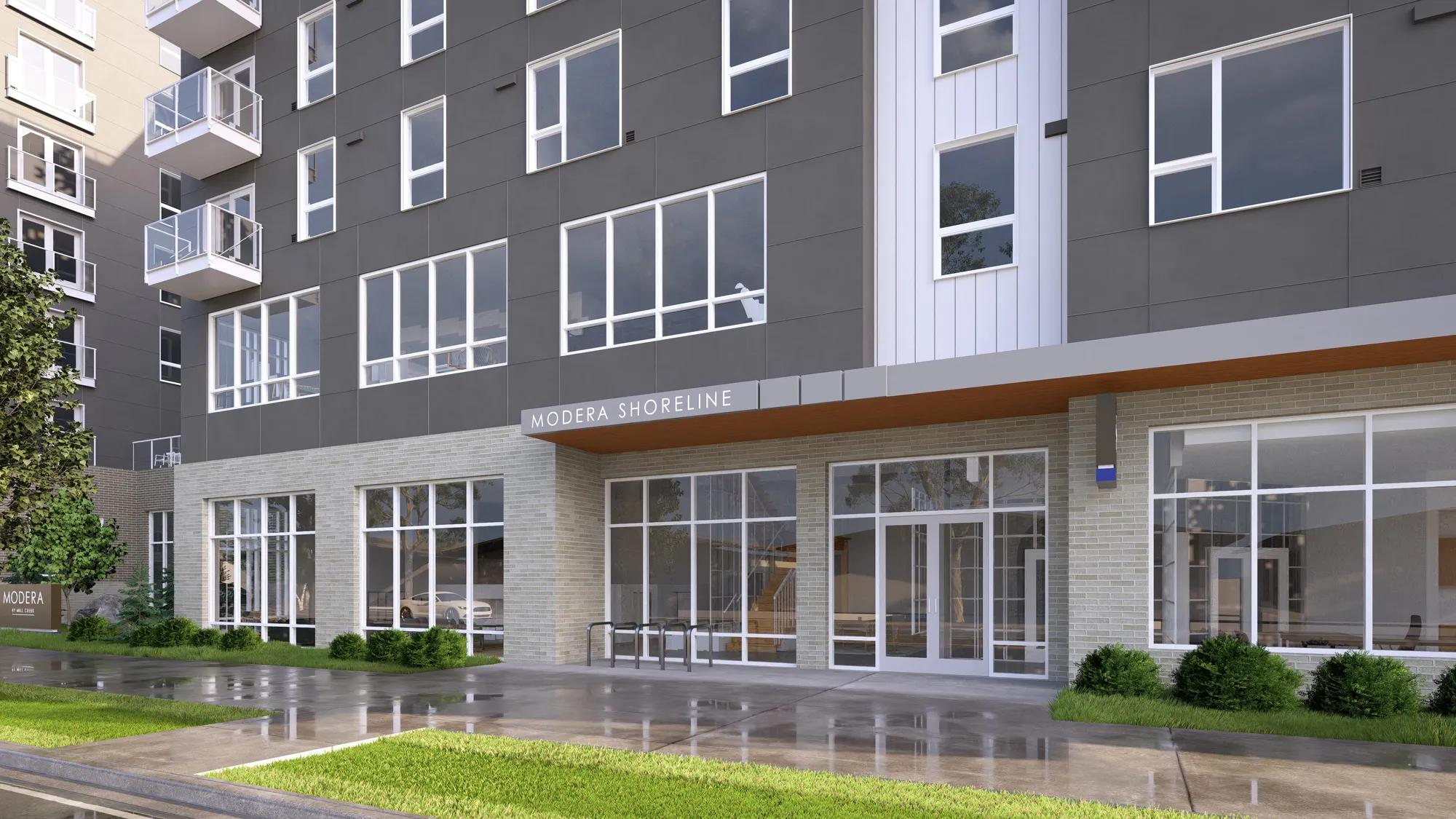 exterior sidewalk entrance with grass at modera shoreline apartment homes for rent in wa