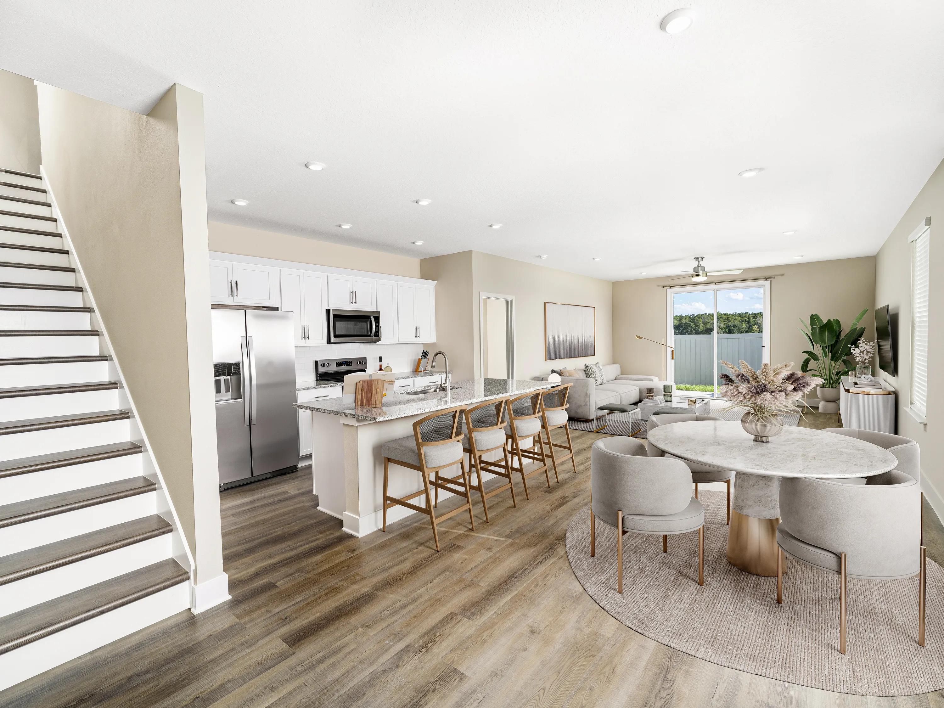 kitchen with white cabinetry and stainless steel appliances amavi kissimmee homes for rent in kissimmee fl