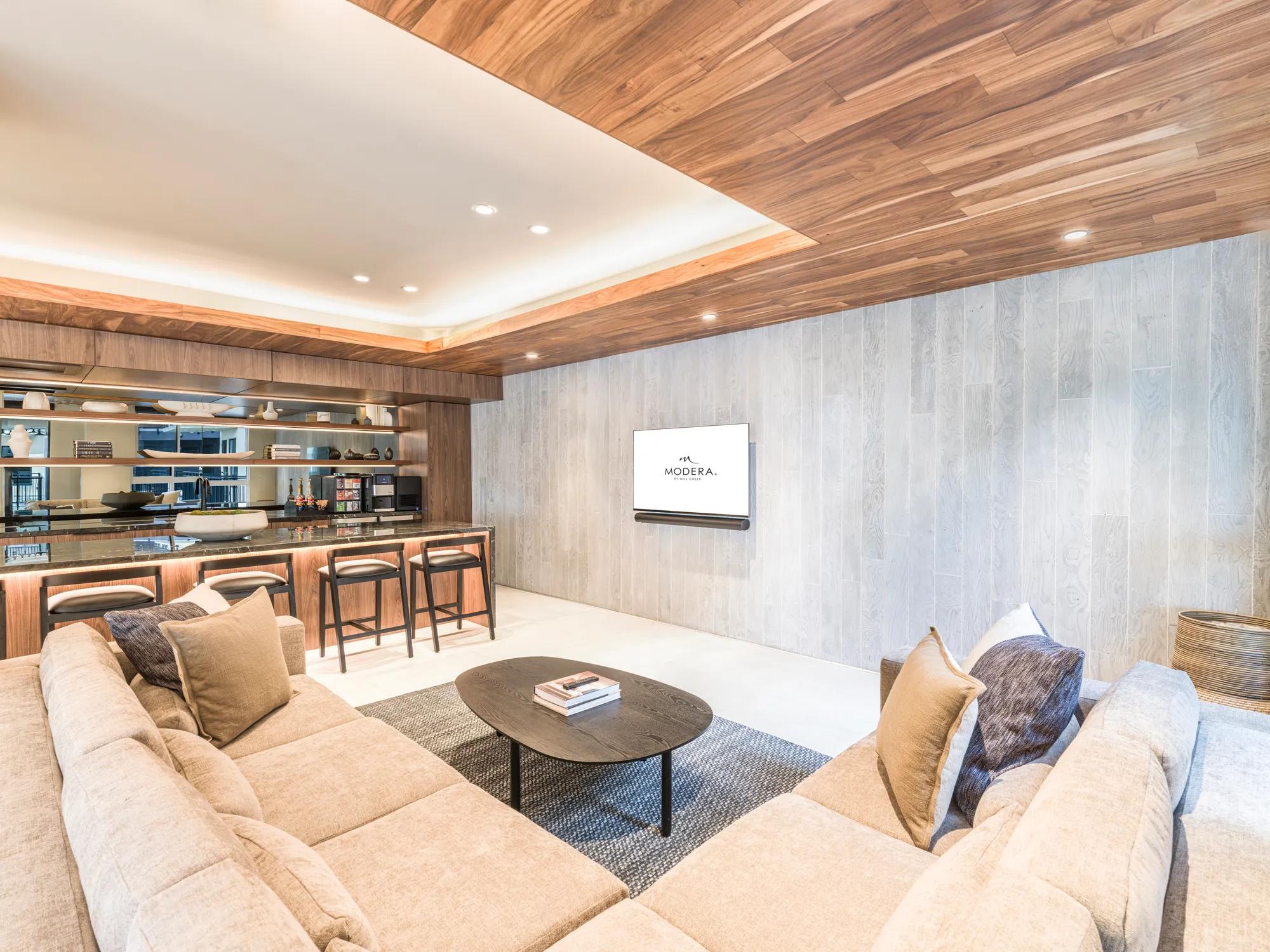 modera golden triangle amenity space with large couch