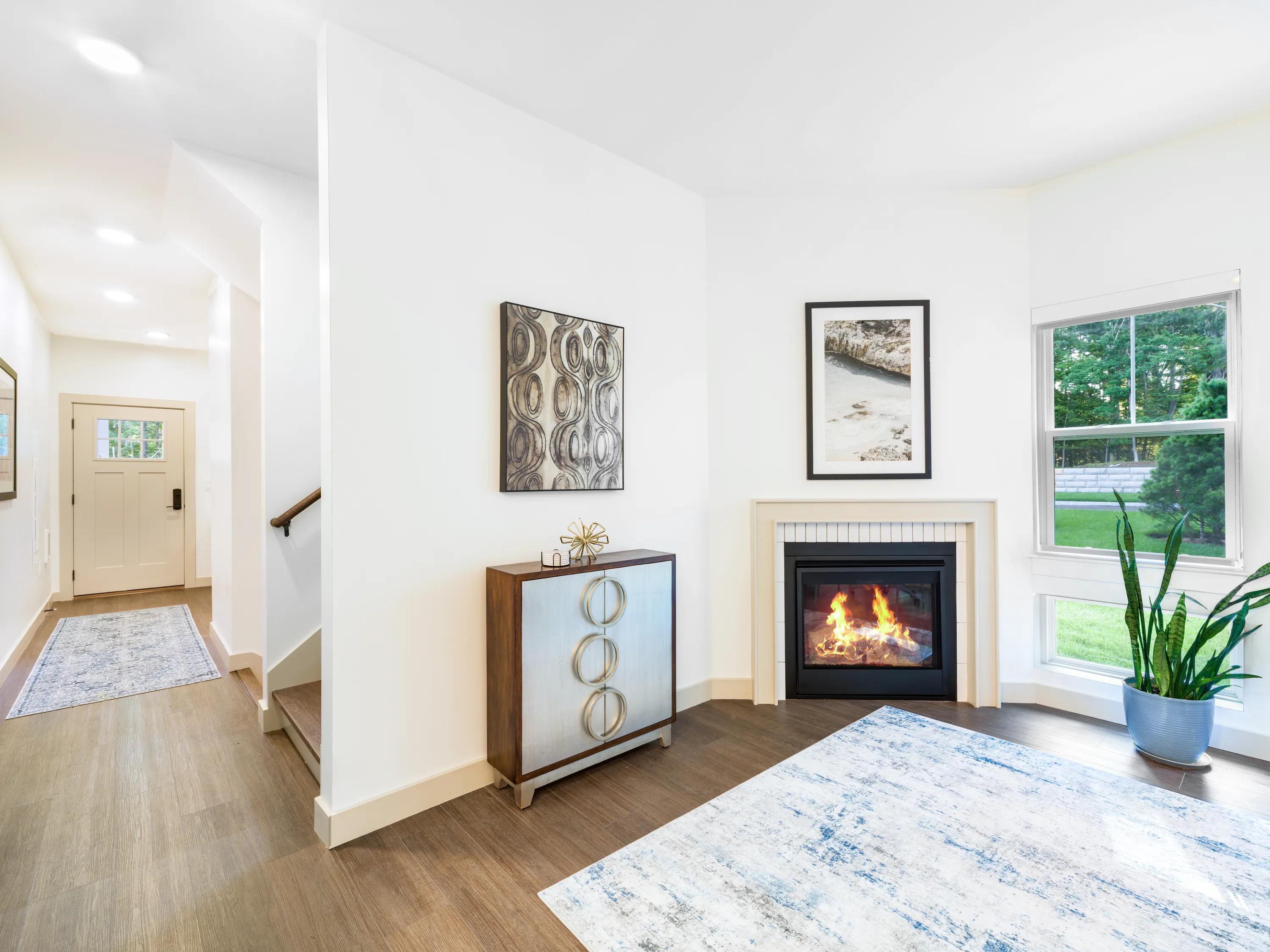 Bright living area with a fireplace available in select homes modera weston apartments and townhomes for rent  for rent in weston ma near boston