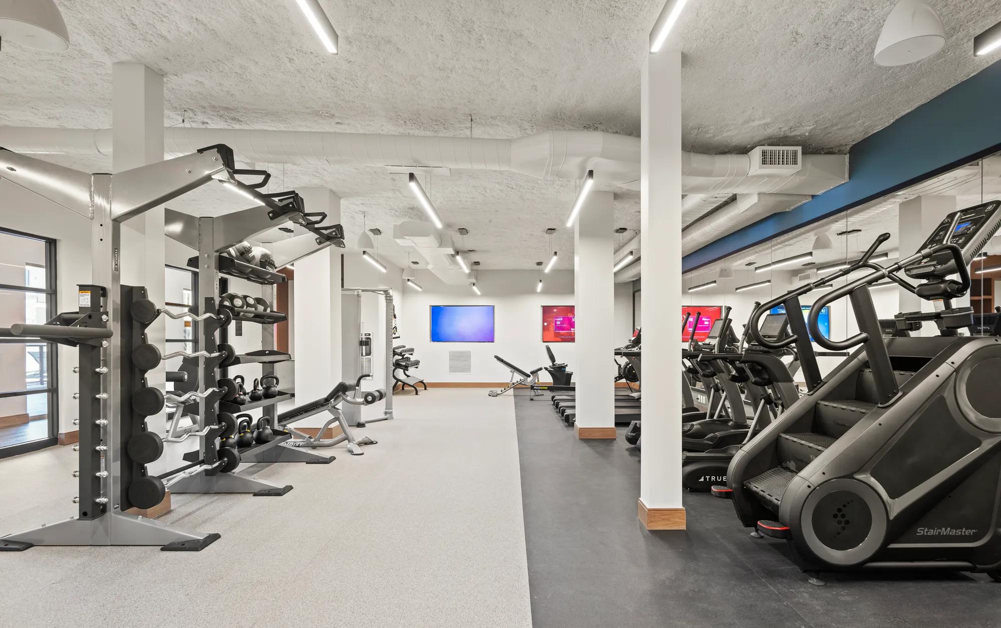 fitness center with high end equipment and tvs at modera newton apartment homes for rent in ma