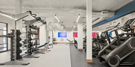 gym with cardio and weight equipment modera newton apartment homes for rent in ma