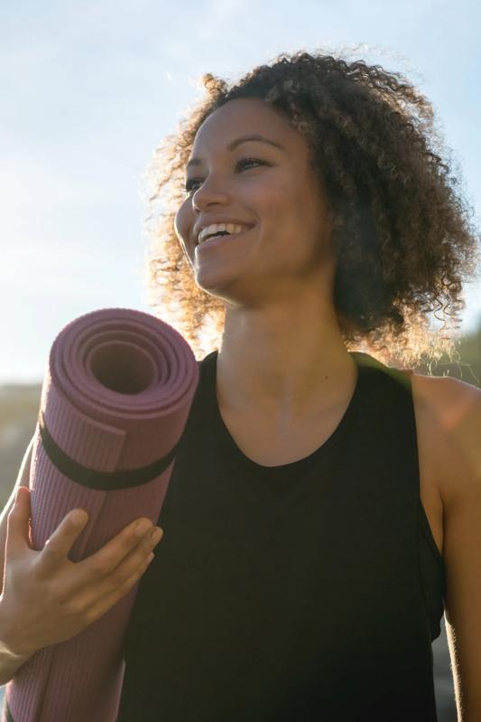 woman with yoga mat modera golden tringle apartments in denver co
