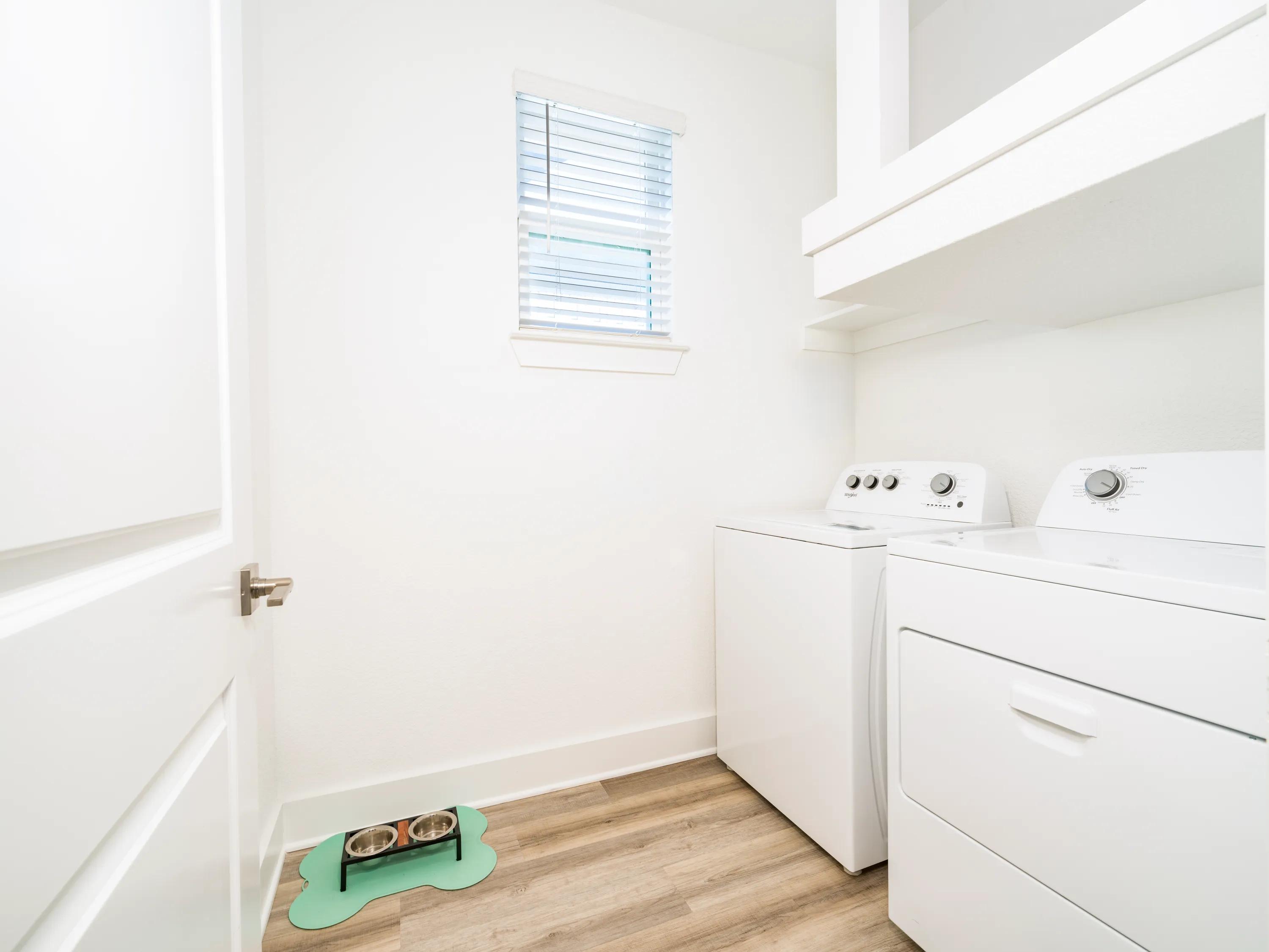 large laundry room with shelving and window amavi celina single family homes for rent in texas