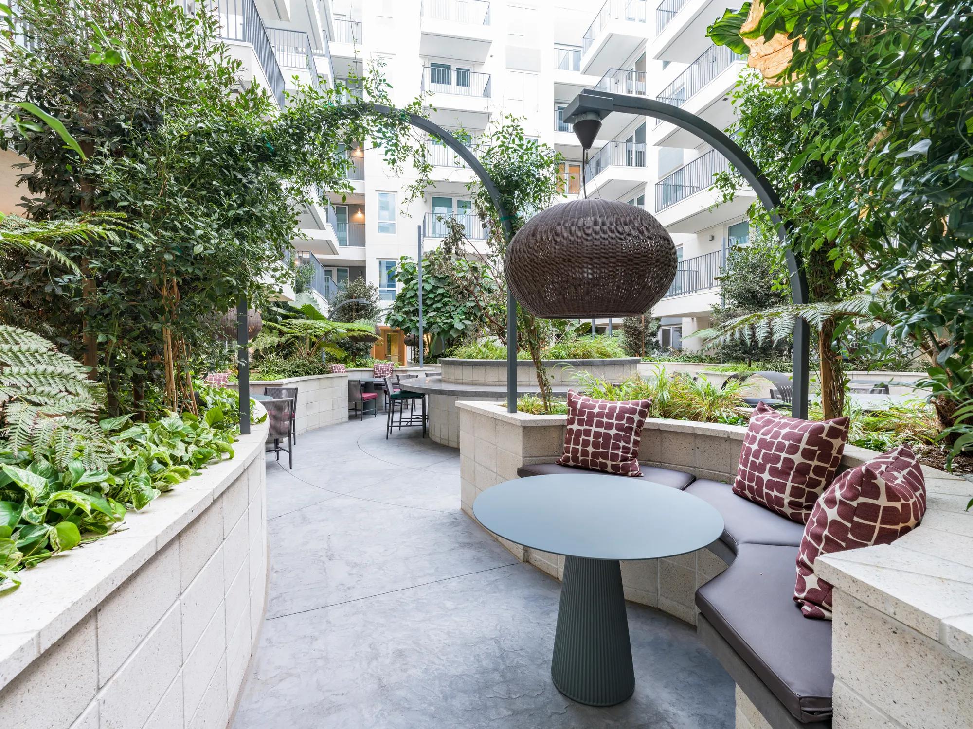 courtyard walking area and relaxation area modera argyle apartments for rent in los angeles ca