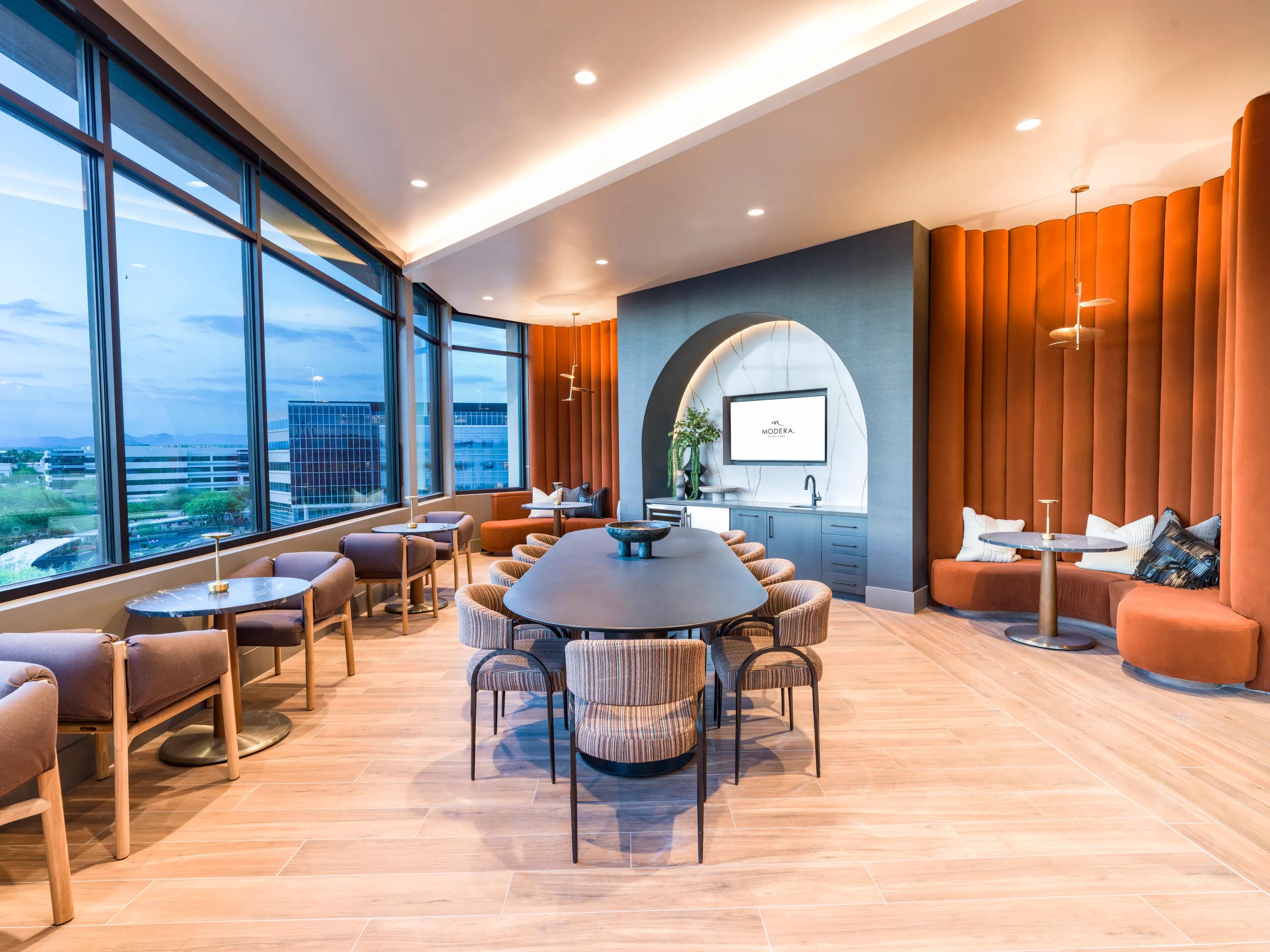 coworking space with tables throughout and large windows modera reserve apartment homes for rent in scottsdale az