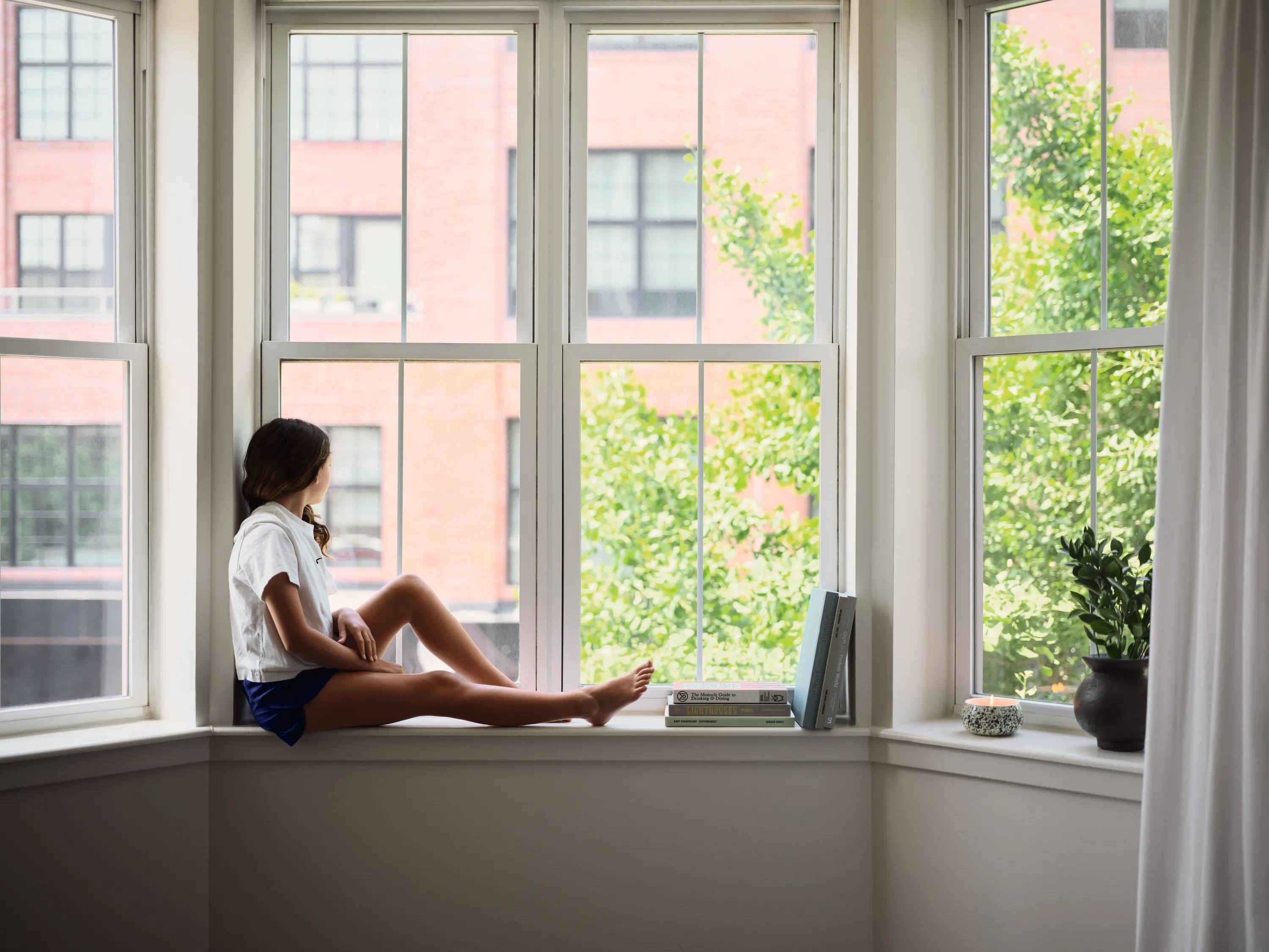 person sitting in window on nice day metropolitan at 40 park apartment homes for rent in morristown nj