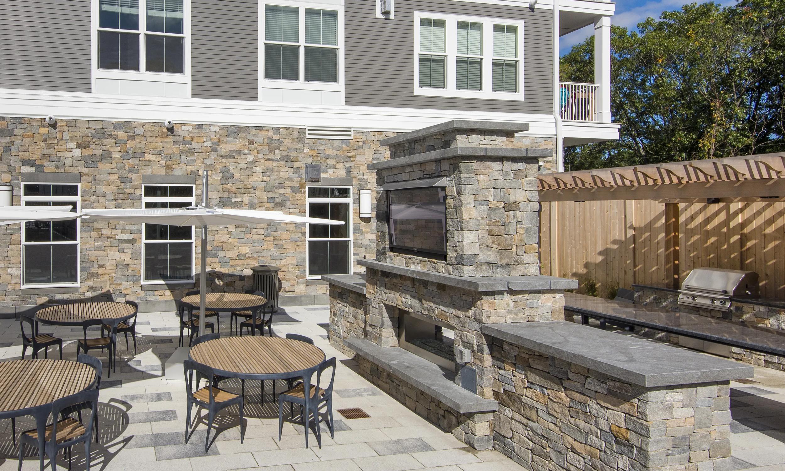 outdoor fireplace and seating modera needham apartment home boston ma