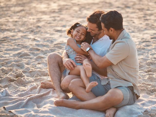 young family sitting on beach modera riverside apartment homes for rent in miami fl