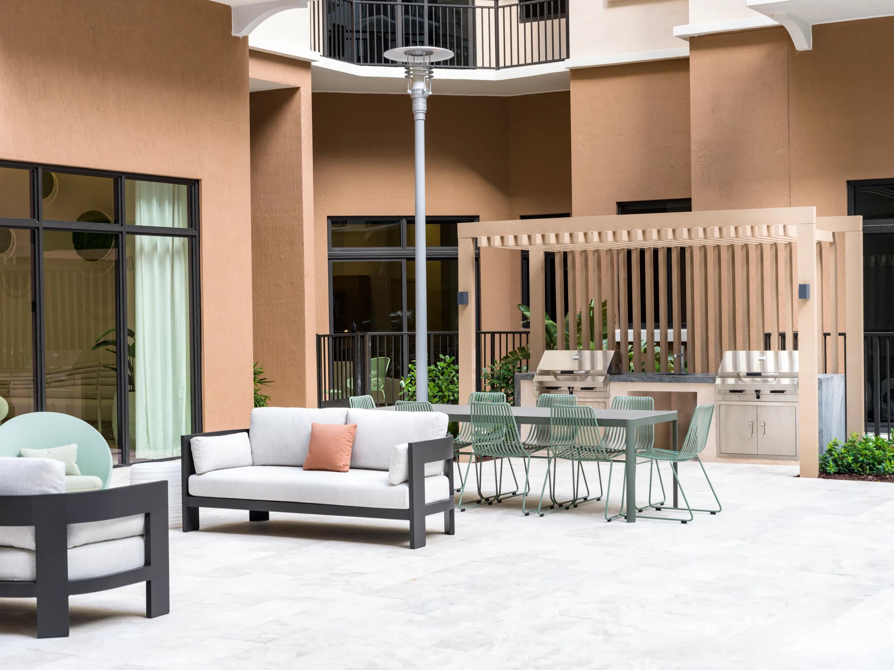 outdoor seating and dining with bbq grill modera academical village apartment homes for rent in davie fl