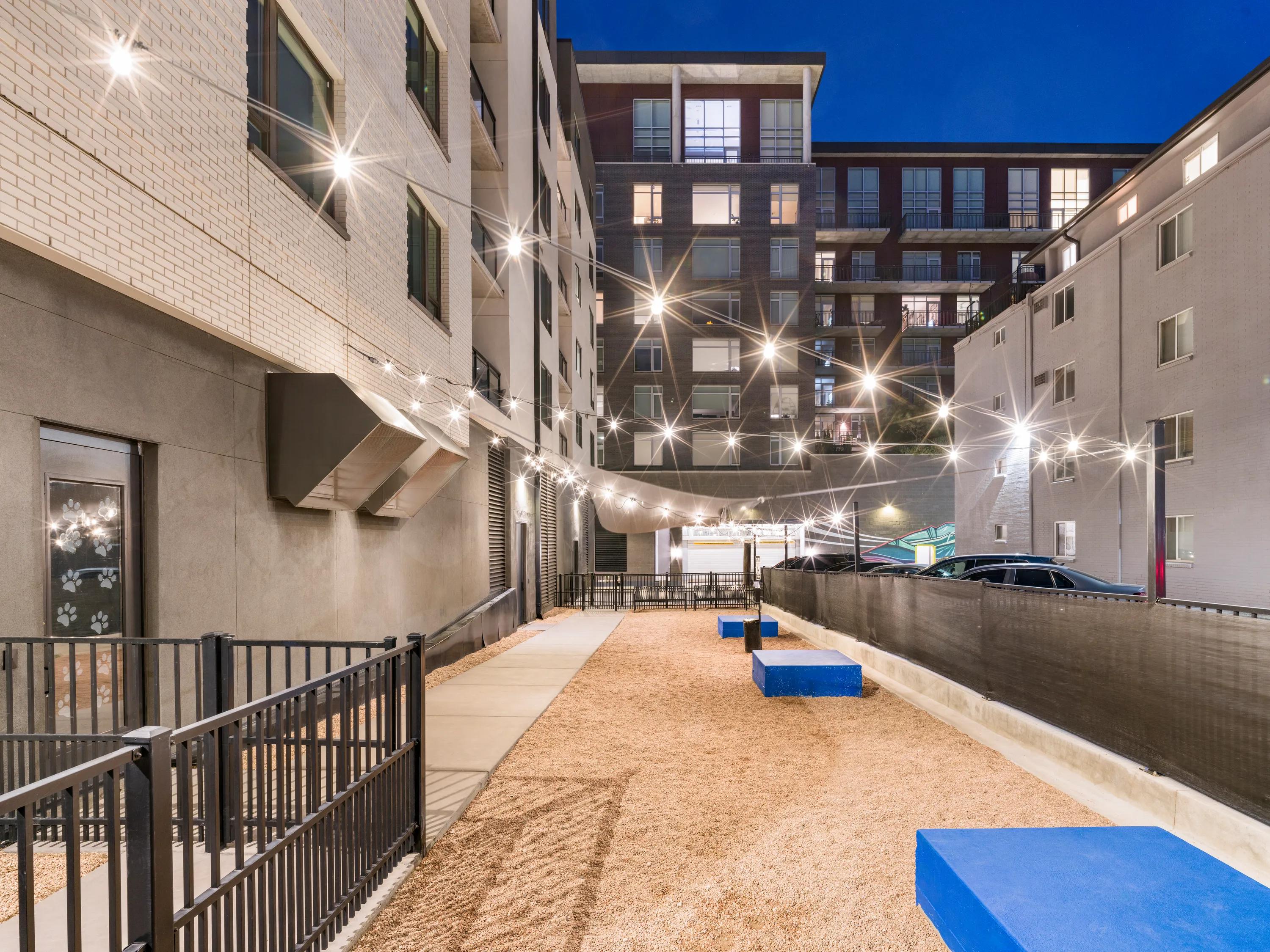 dog park with nighttime lighting modera west wash apartments for rent denver co