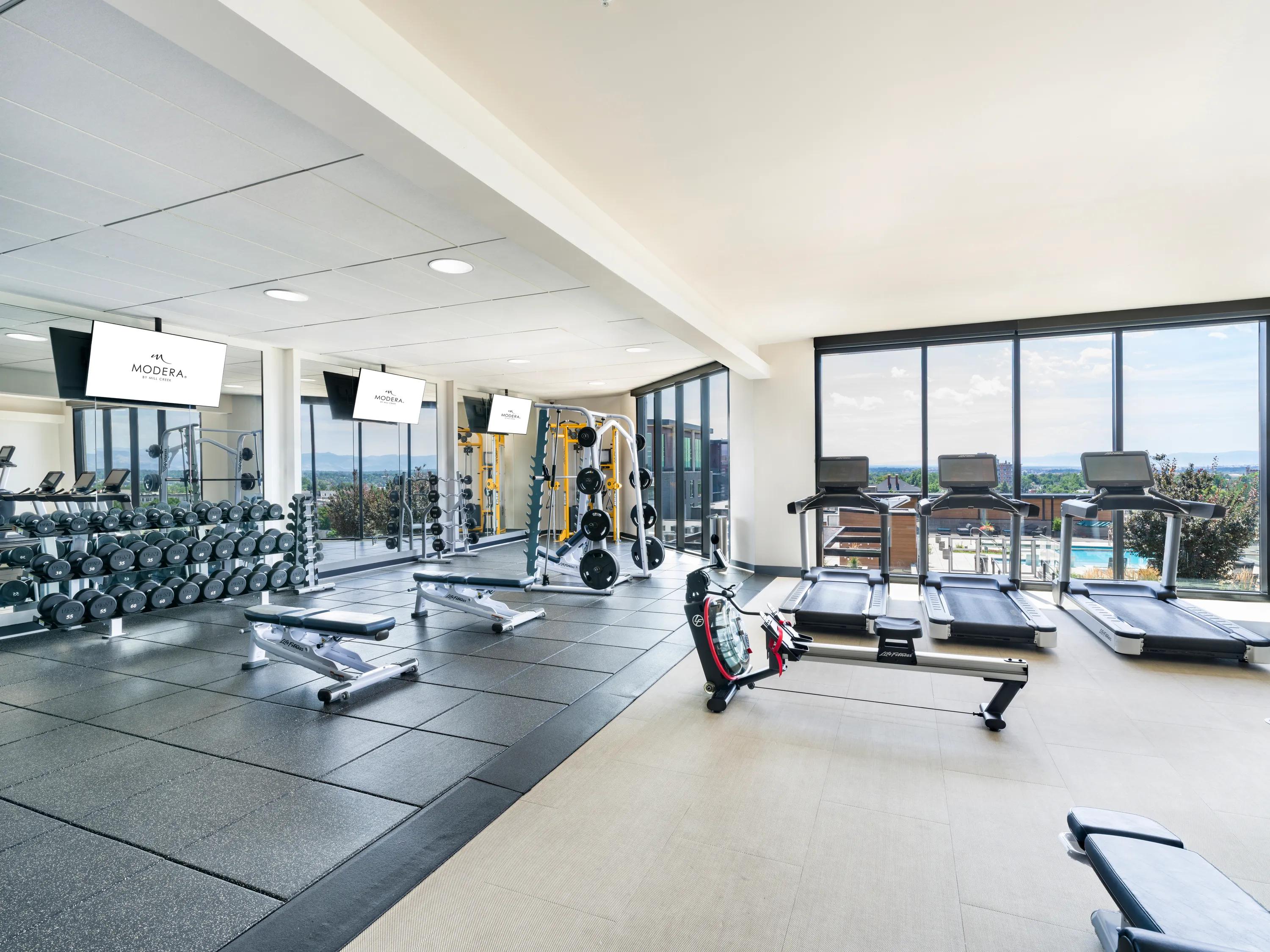 Exercise equipment in fitness centermodera west wash apartments for rent denver co